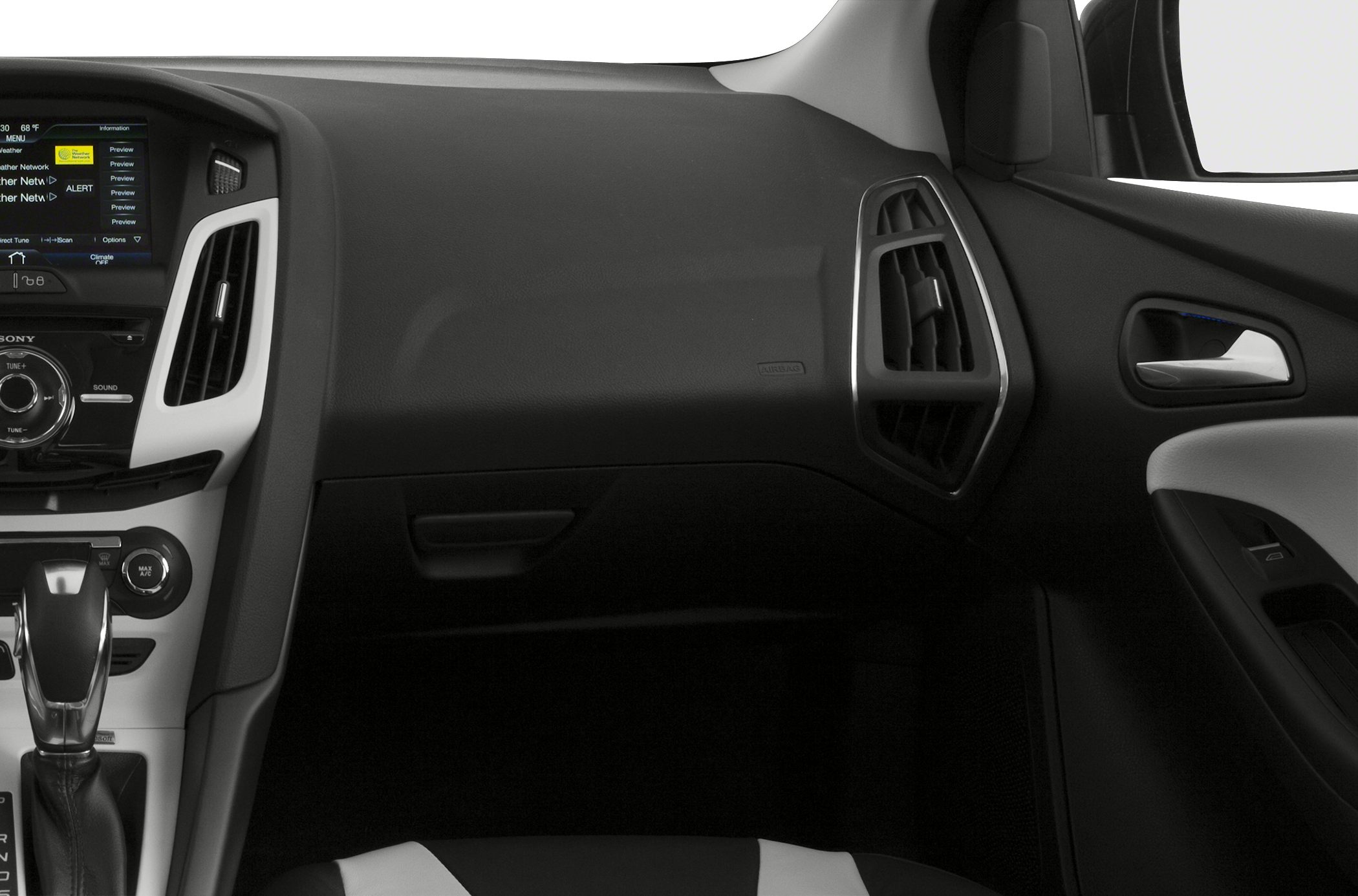 Dashboard with air vents and center console featuring gear shifter and infotainment system