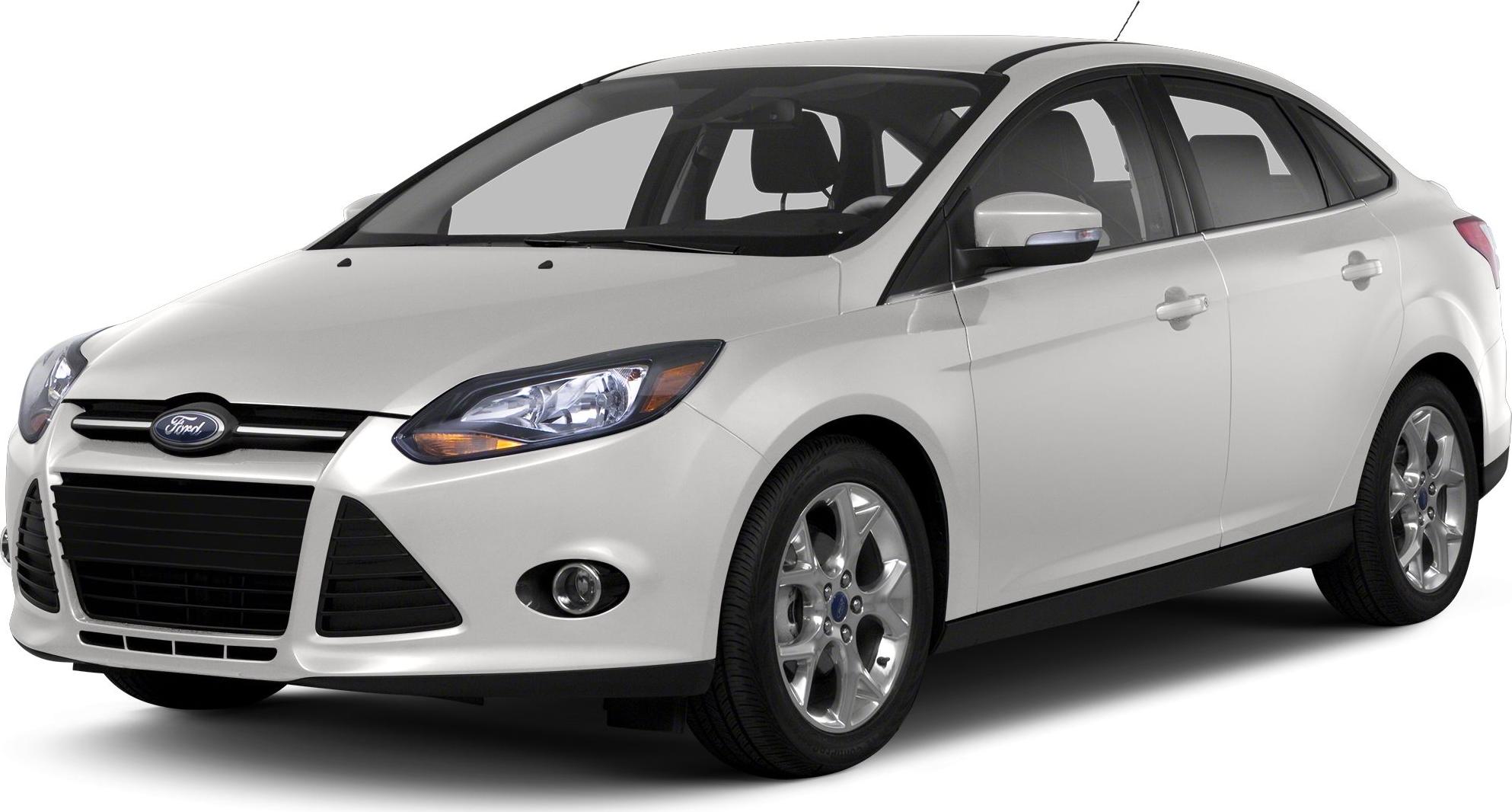 Front view of white sedan with headlights and alloy wheels