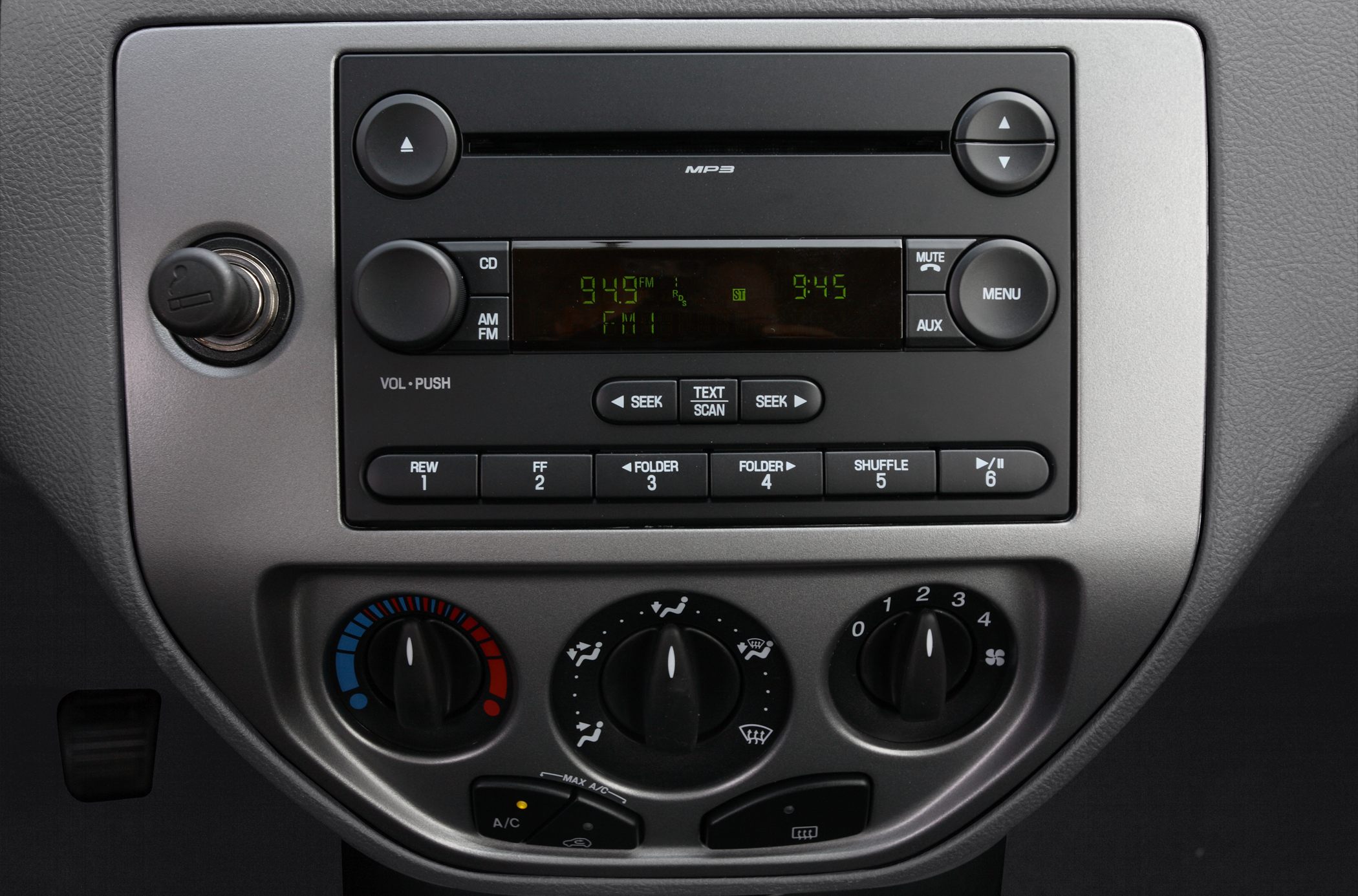 Car audio system and manual climate control knobs on dashboard