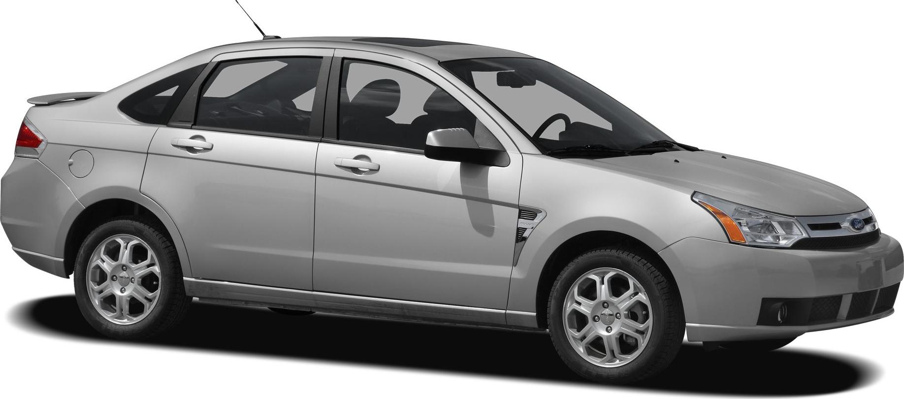 Side profile of a silver sedan with alloy wheels and rear spoiler