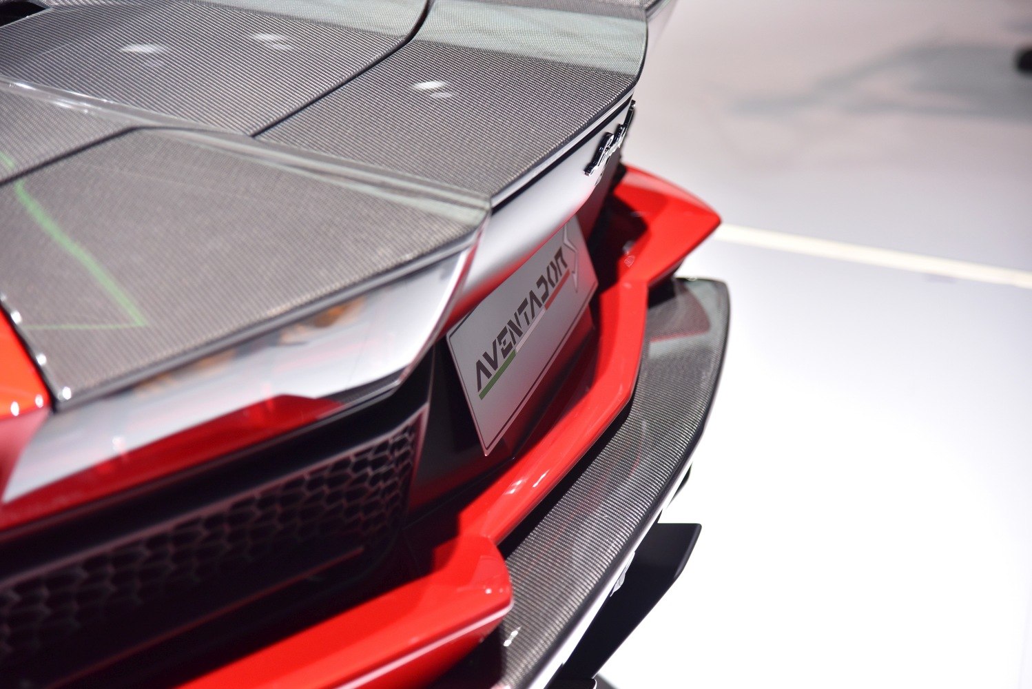 Rear carbon fiber spoiler and diffuser with red accents
