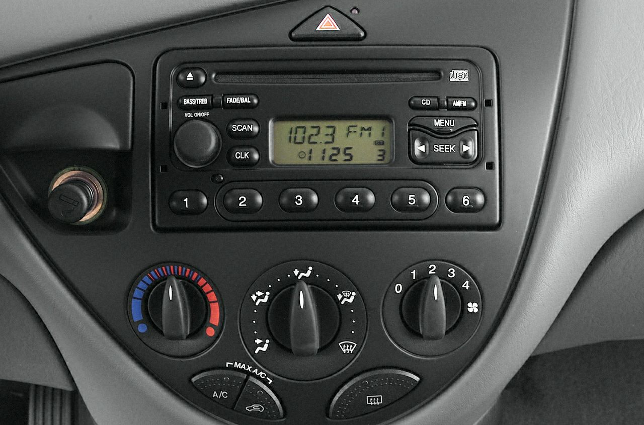 Classic dashboard audio and climate control panel with radio and knobs