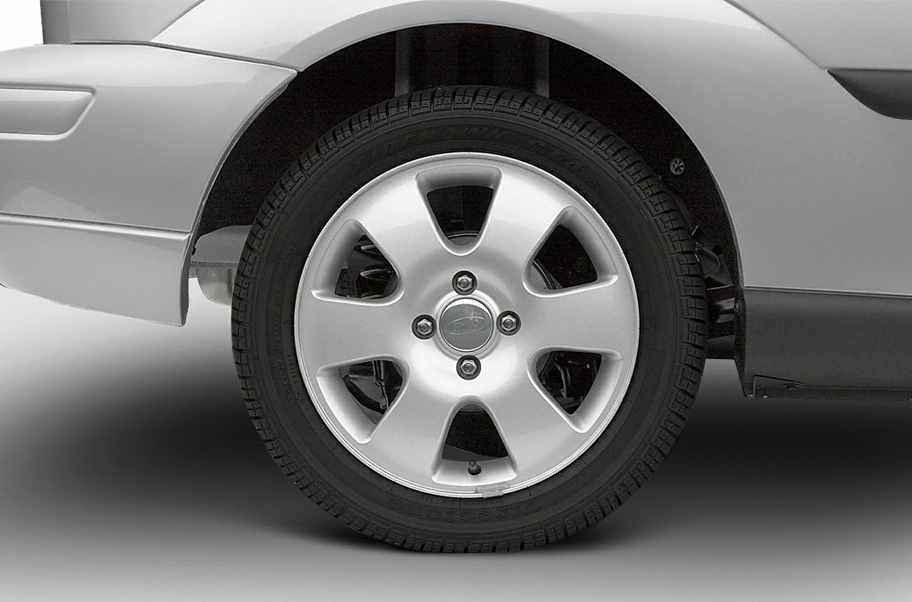 Close-up of alloy wheel and tire with five-spoke rim design.