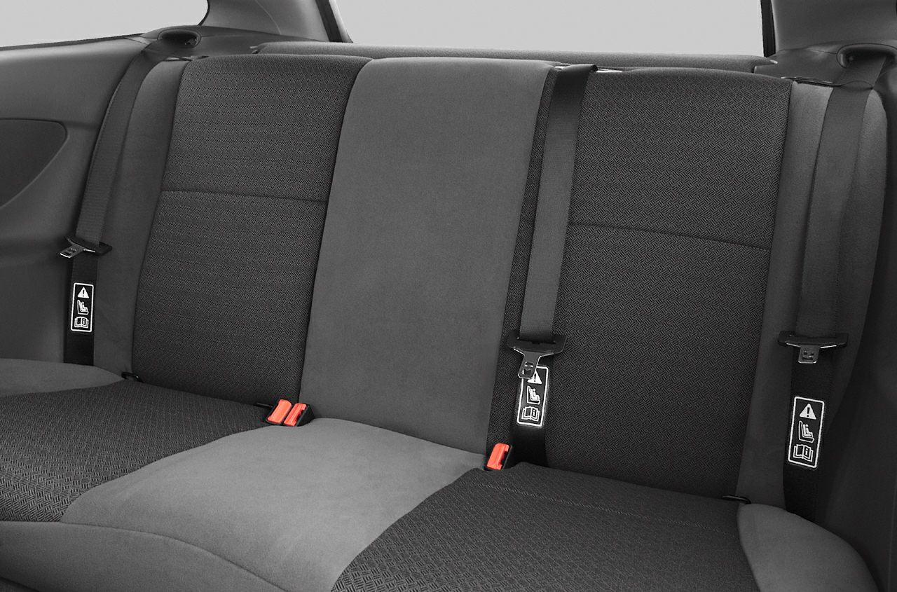 Rear seat with fabric upholstery and seatbelt details