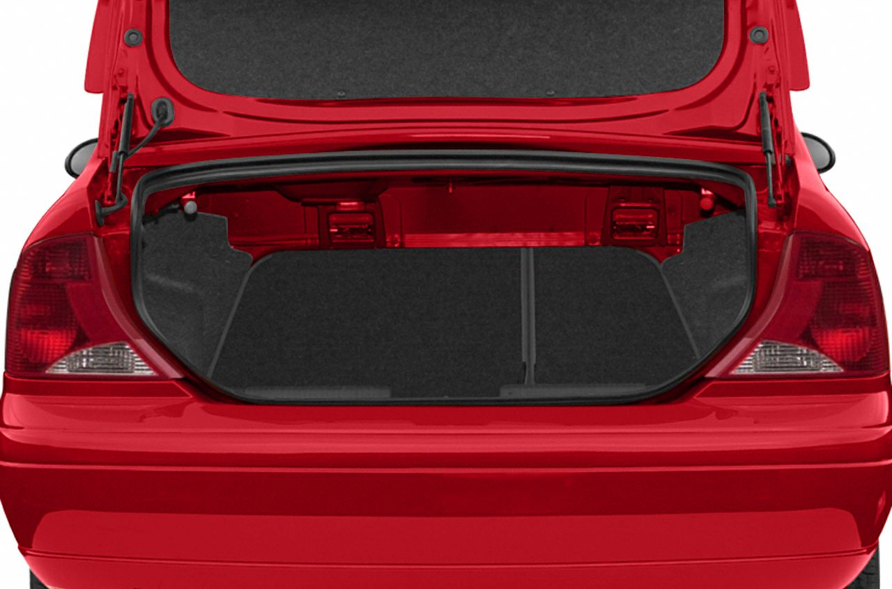 Open rear trunk of a red hatchback station wagon