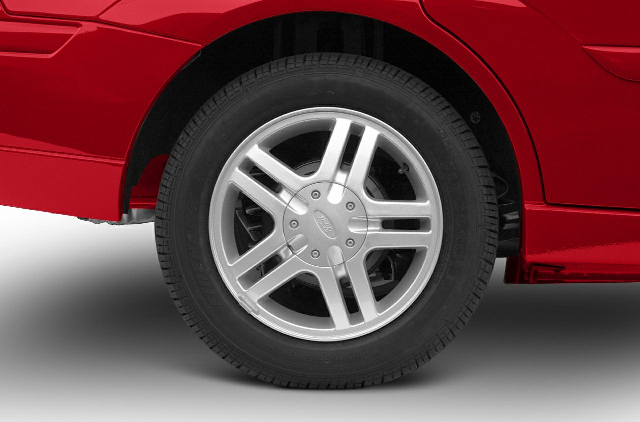 Alloy wheel and tire close-up with five double spokes