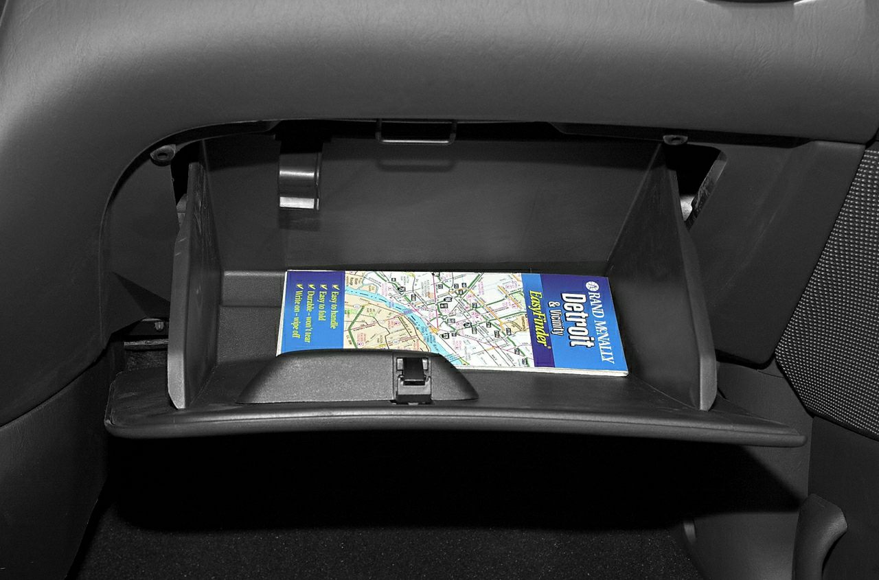 Open glove compartment with a map inside