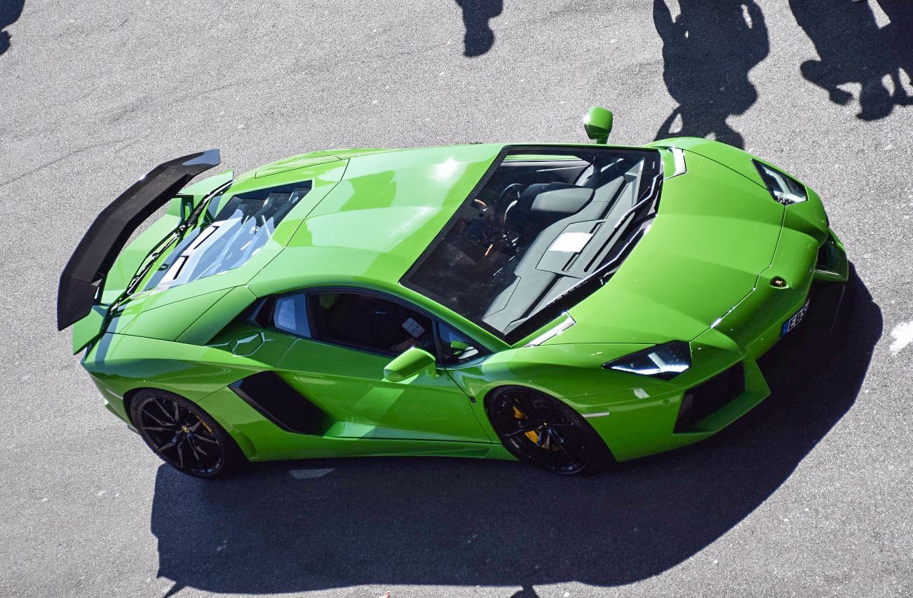 Top view of a coupe with a rear wing and side air intakes