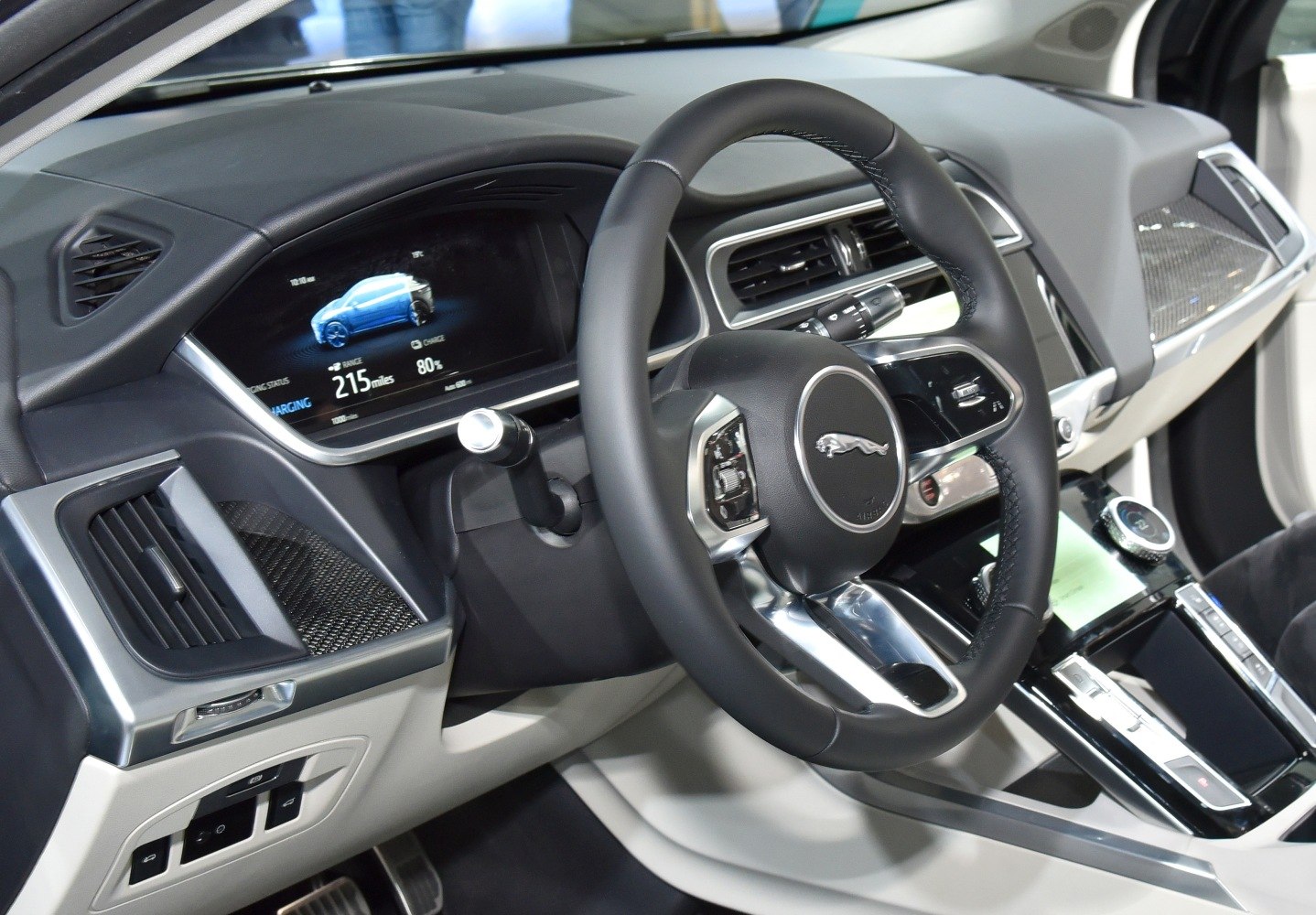 Modern dashboard with digital display and leather steering wheel
