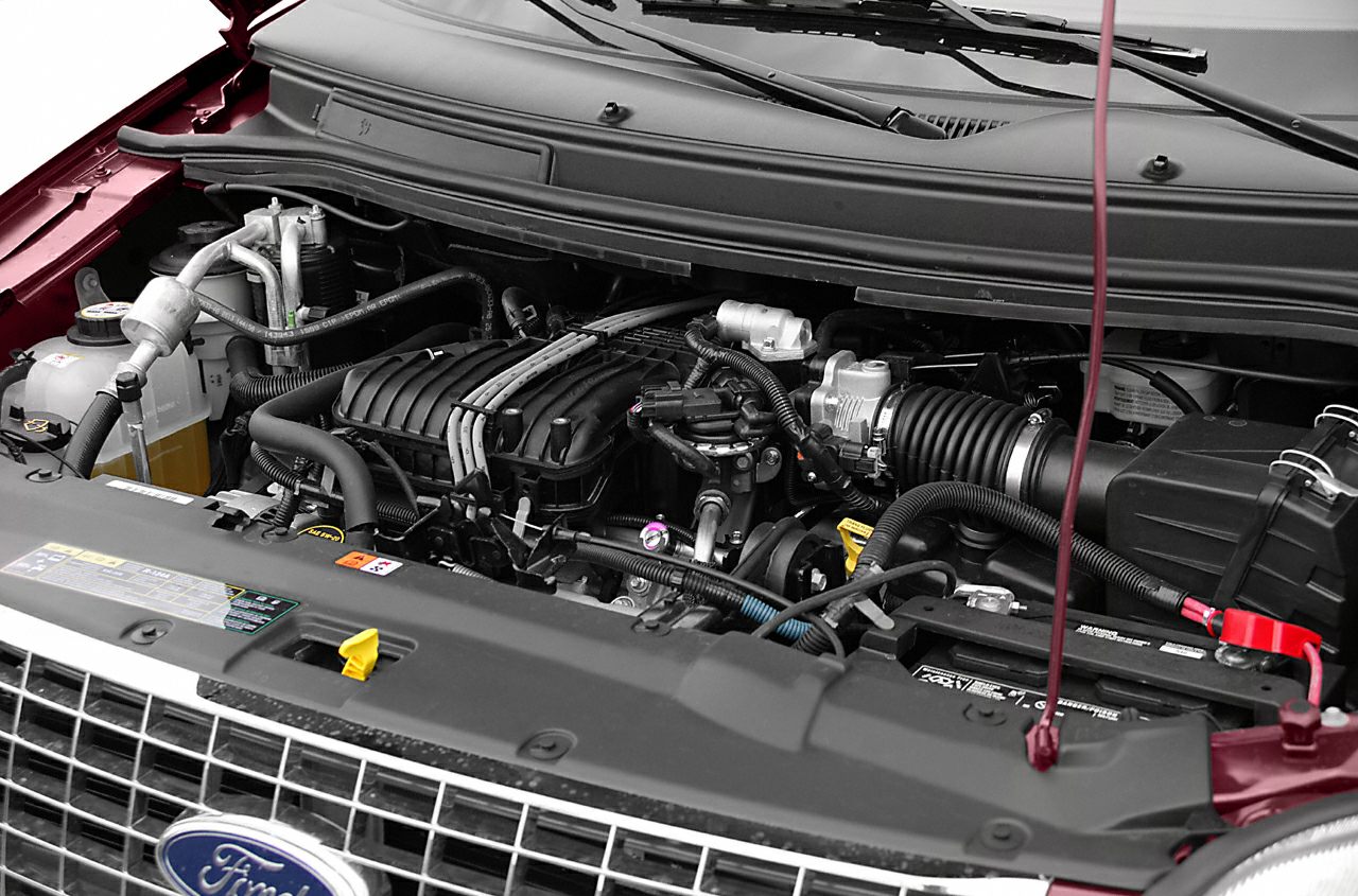 Close-up of engine bay with visible components and hoses