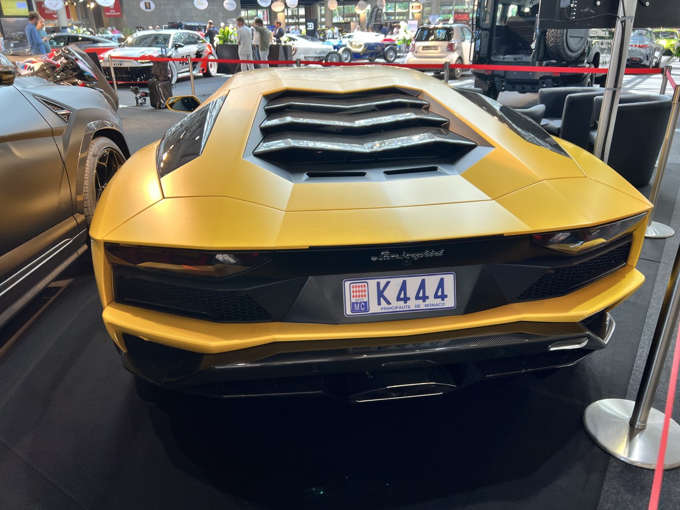 Angular rear view with aerodynamic rear engine cover ramps and signature taillights