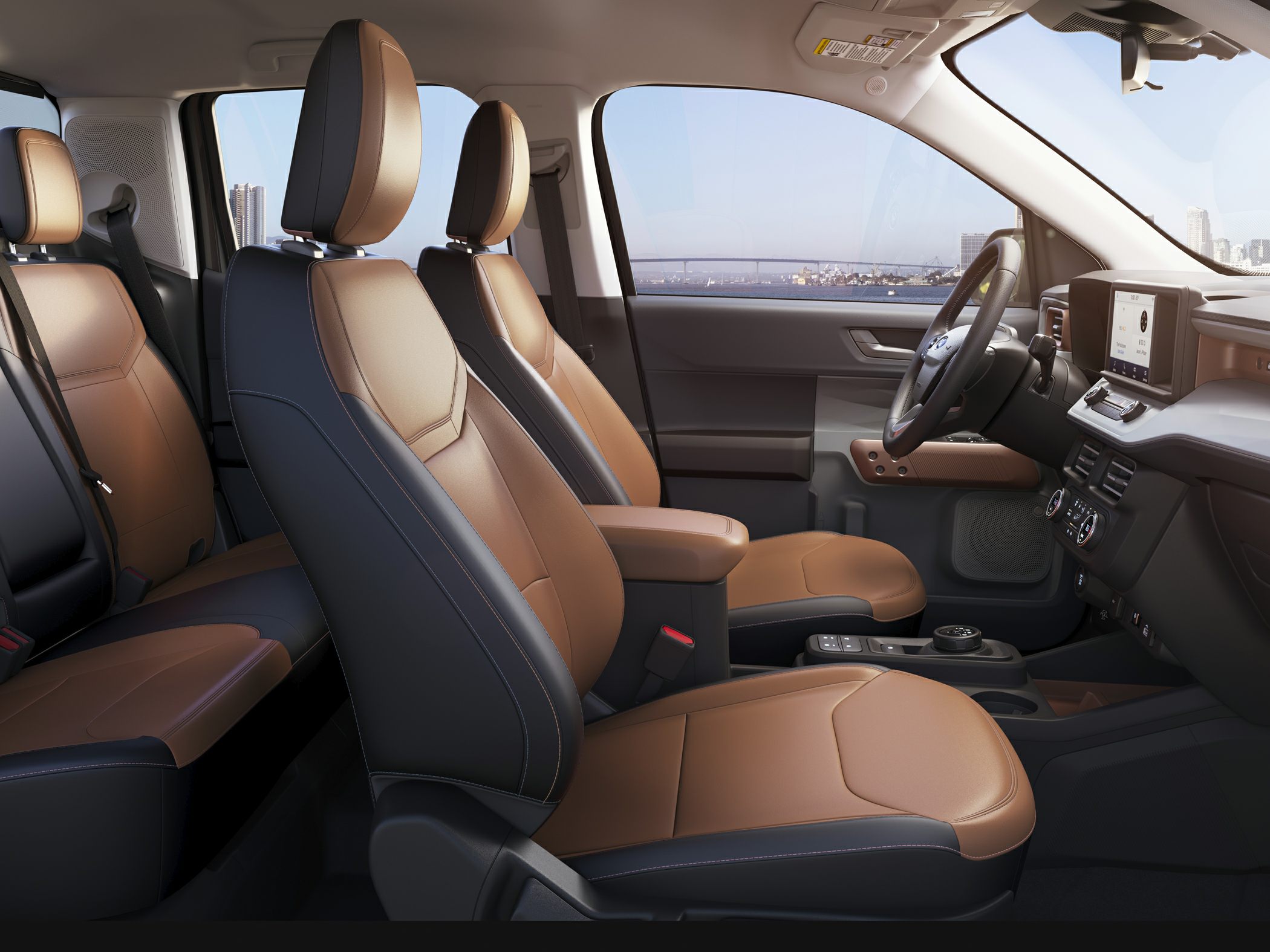 Two-tone brown leather seats and modern dashboard interior