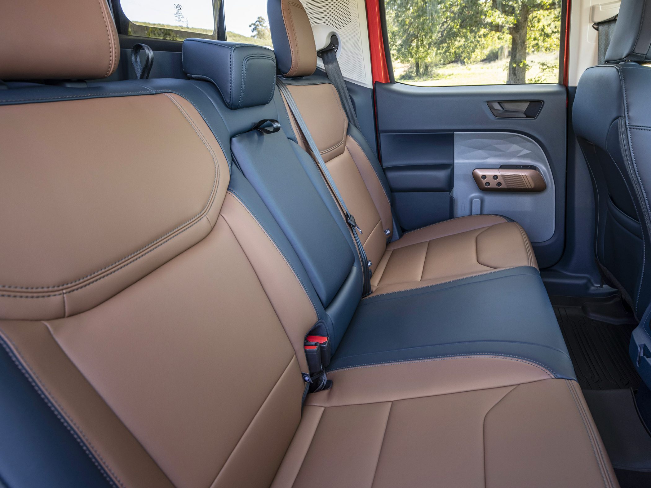 Rear seat with two-tone leather upholstery and modern door panel