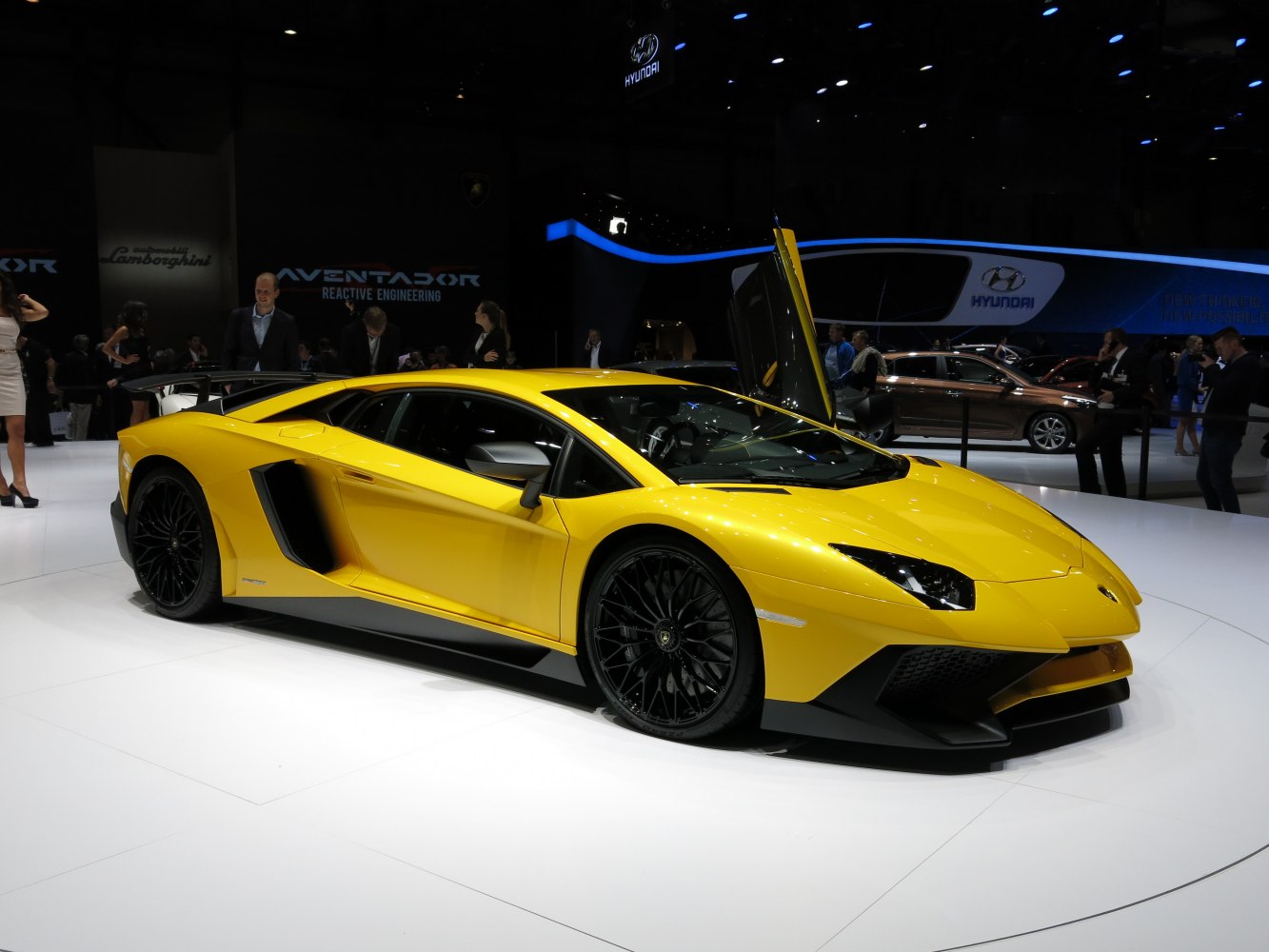 Yellow sports car with scissor door and black wheels