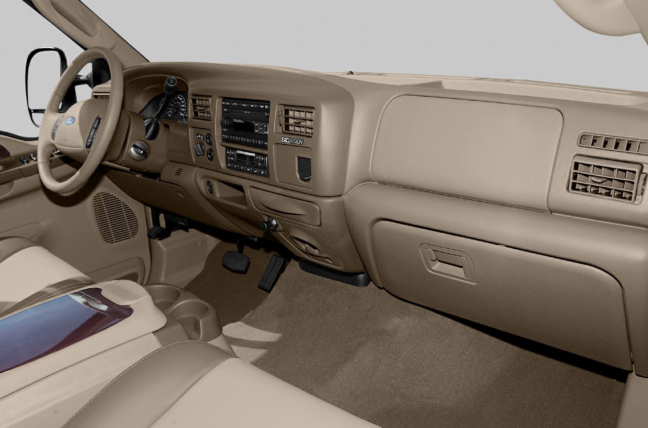 Beige dashboard and classic steering wheel with detailed control panel