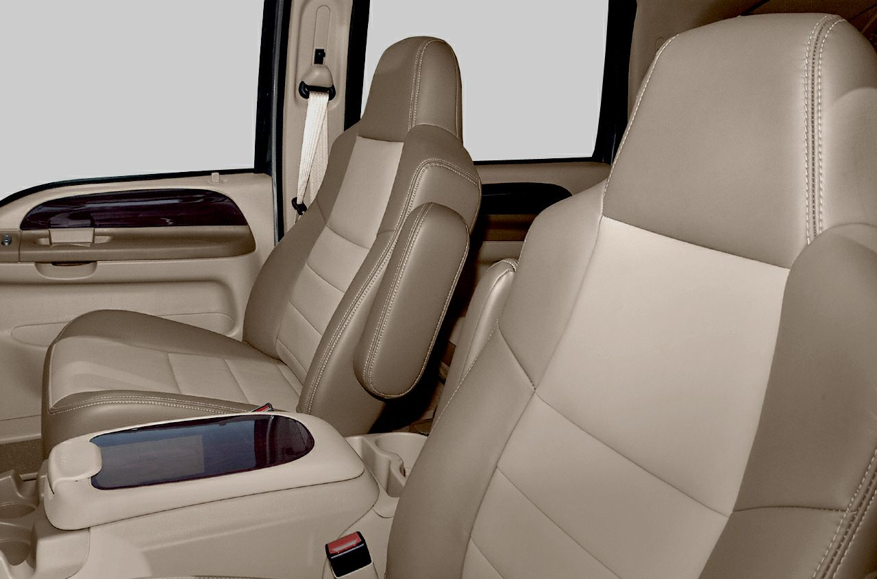 Beige leather seats with padded center armrest