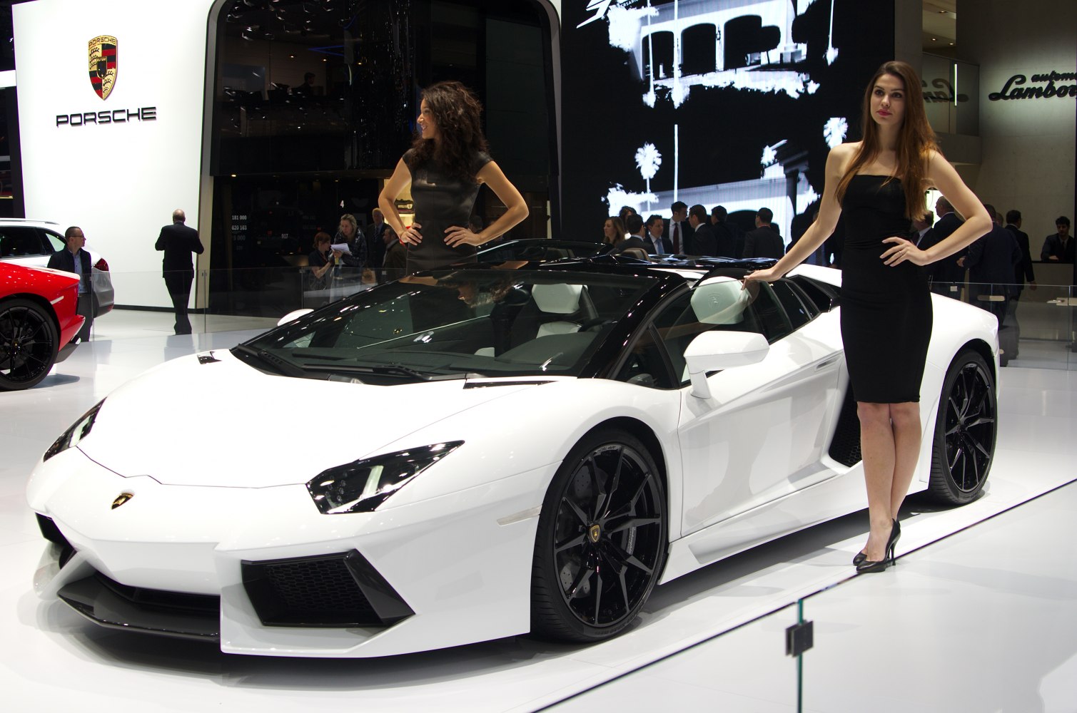 White convertible supercar with black wheels and sharp angular design