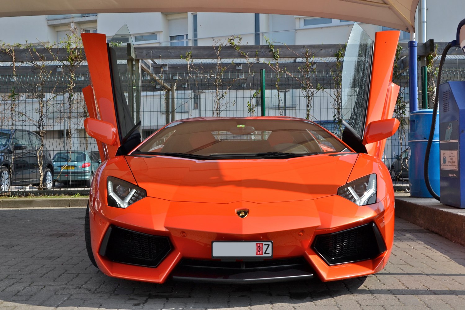 Front view with open scissor doors and LED headlights