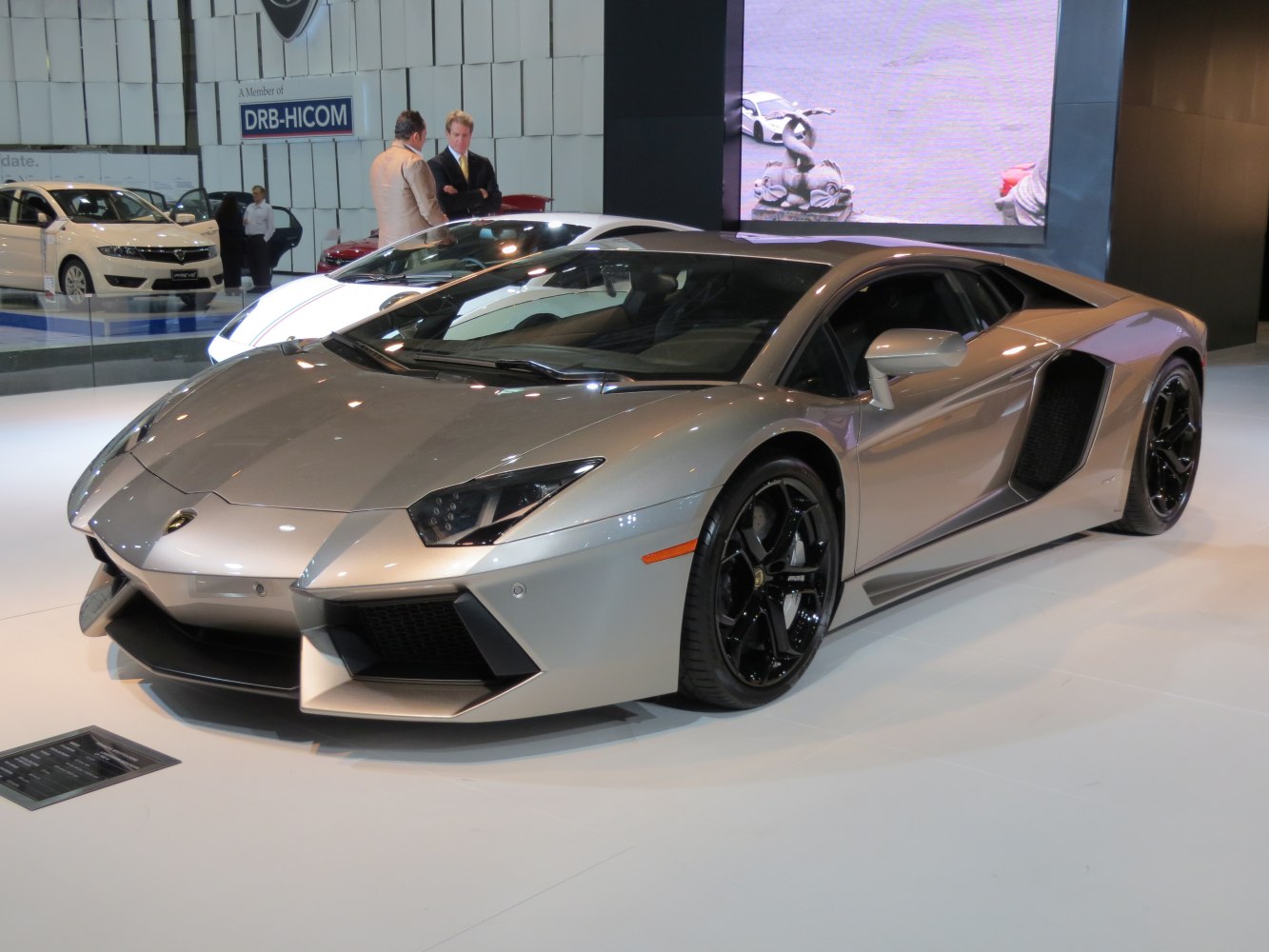 Angular sports coupe with aggressive front splitter and deep side air intakes