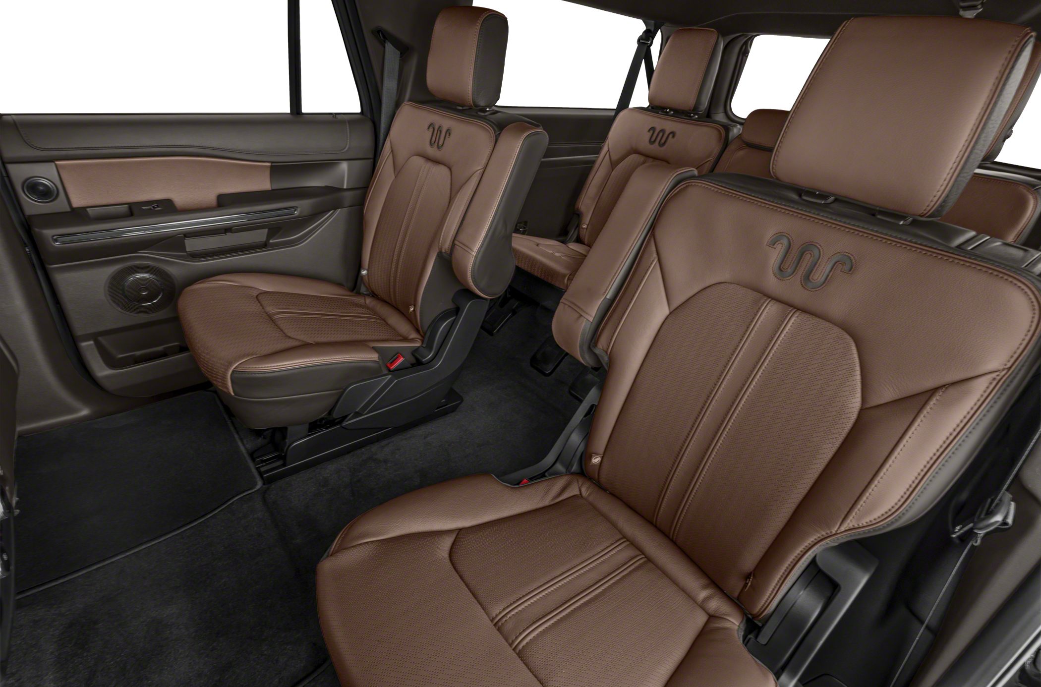 Spacious brown leather rear seats and door panel speaker in luxury SUV interior