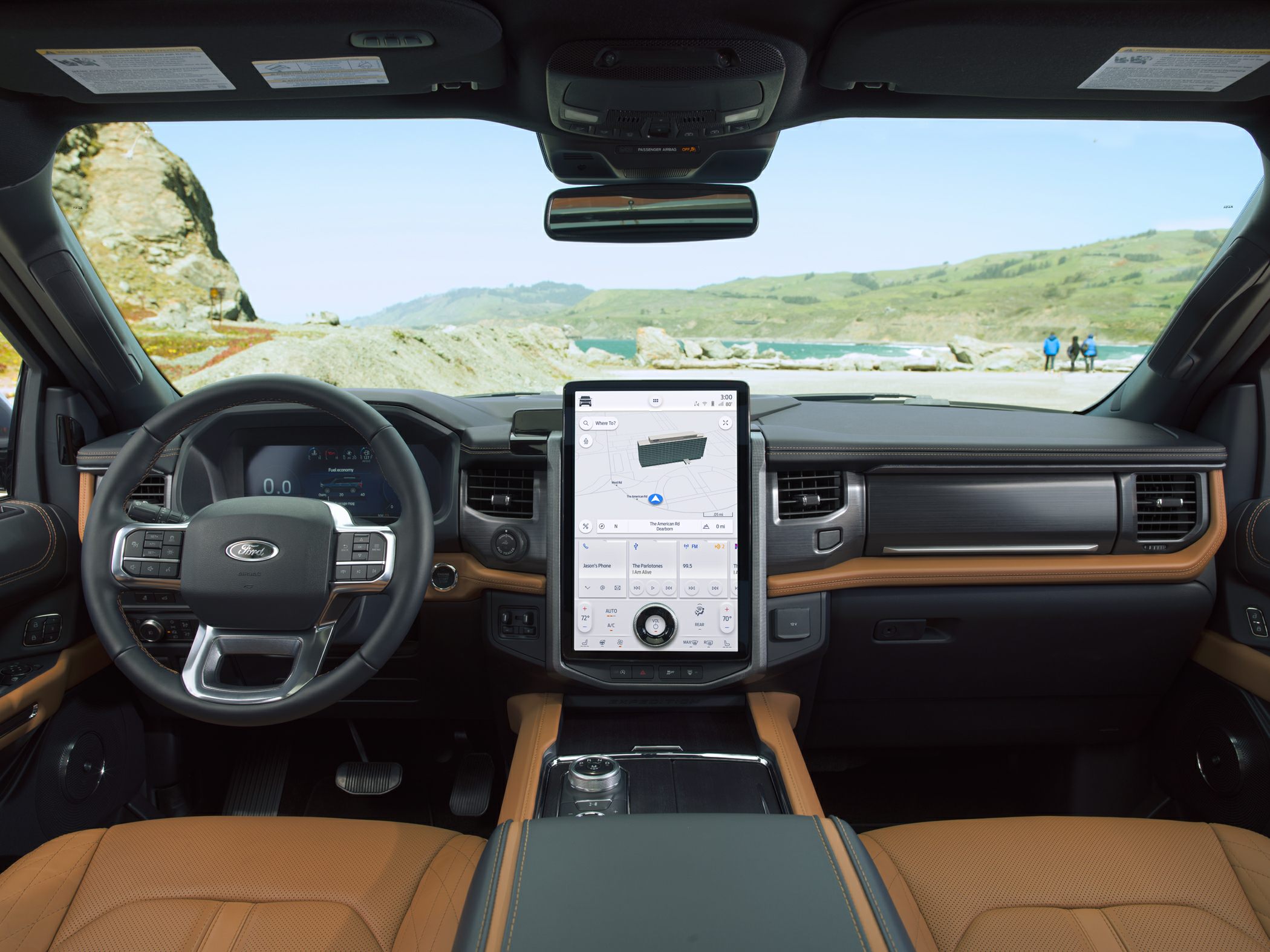 Large vertical touchscreen and luxury leather seats in SUV interior