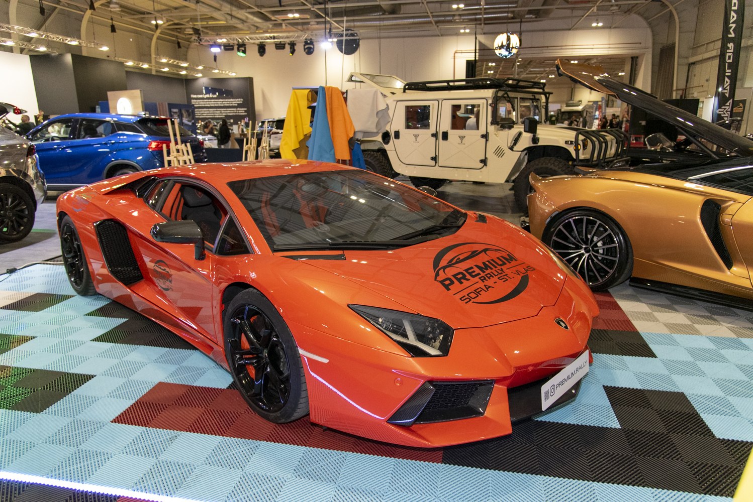 Front and side view of orange luxury coupe