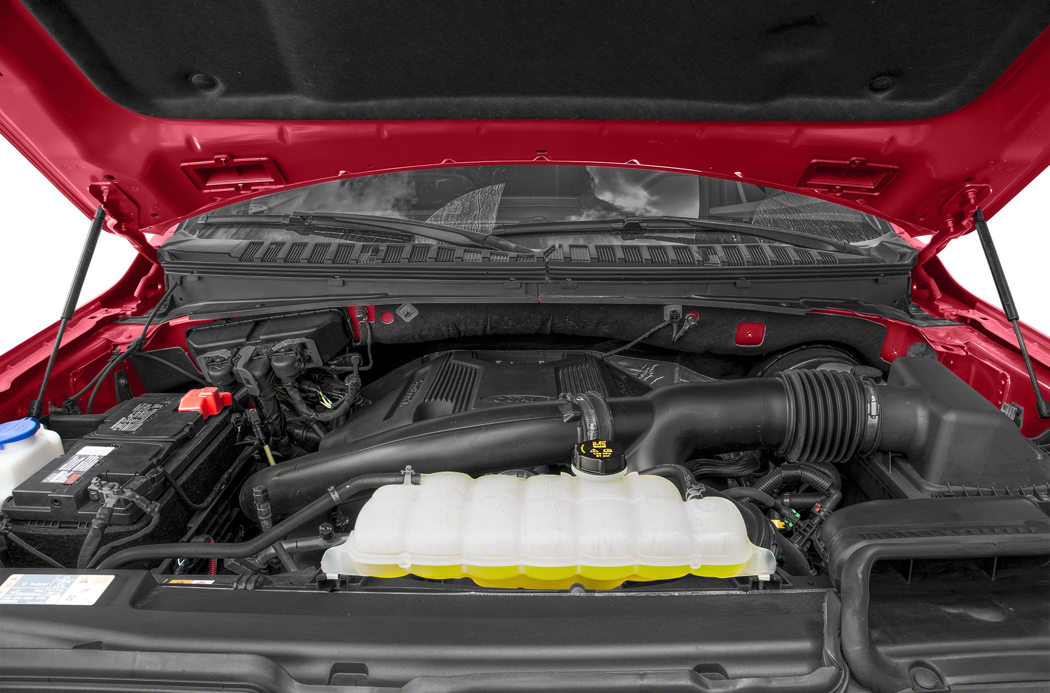 Engine bay with cooling reservoir, air intake, and battery