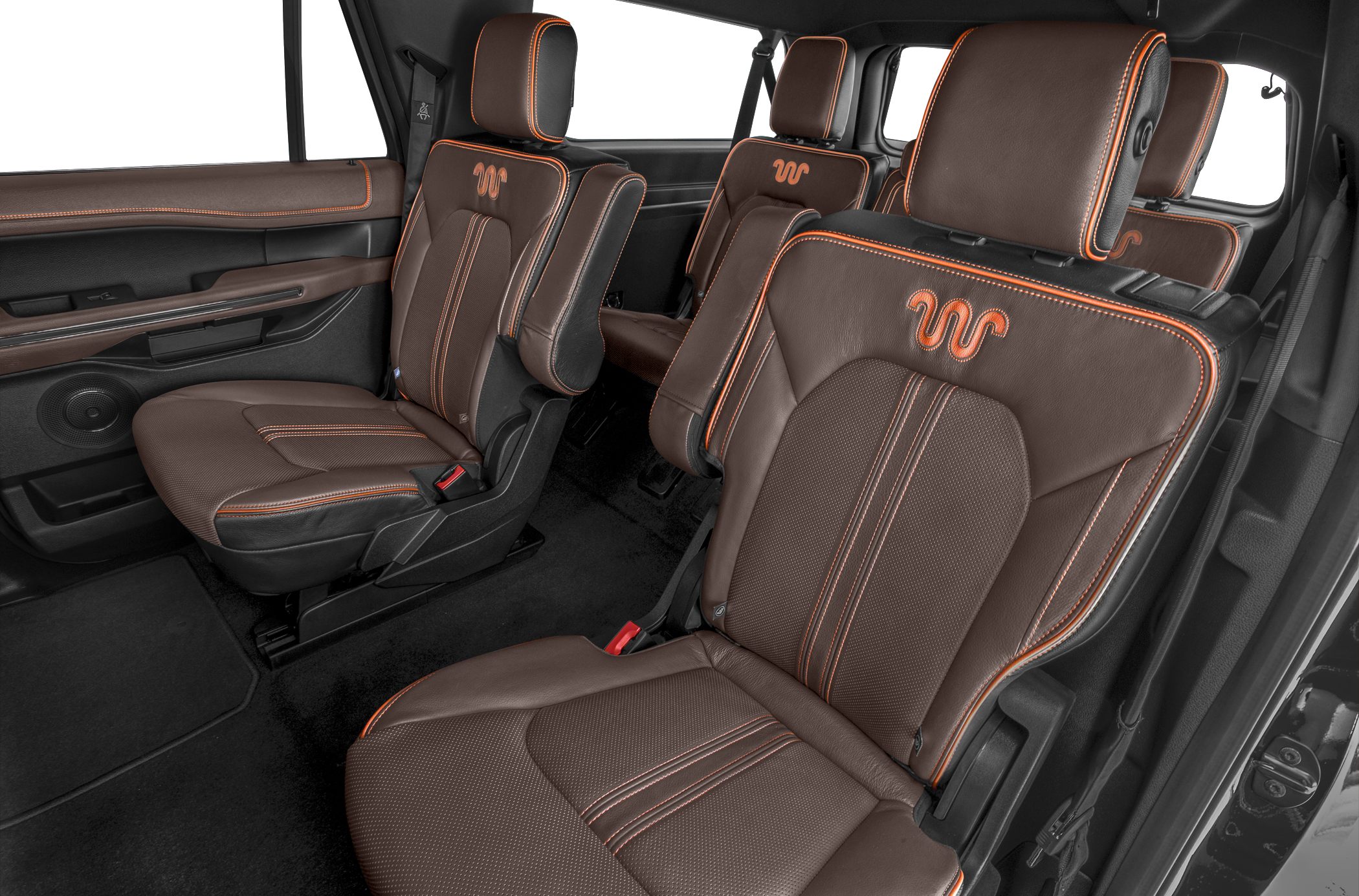 Brown leather SUV seats with orange stitching and embroidery