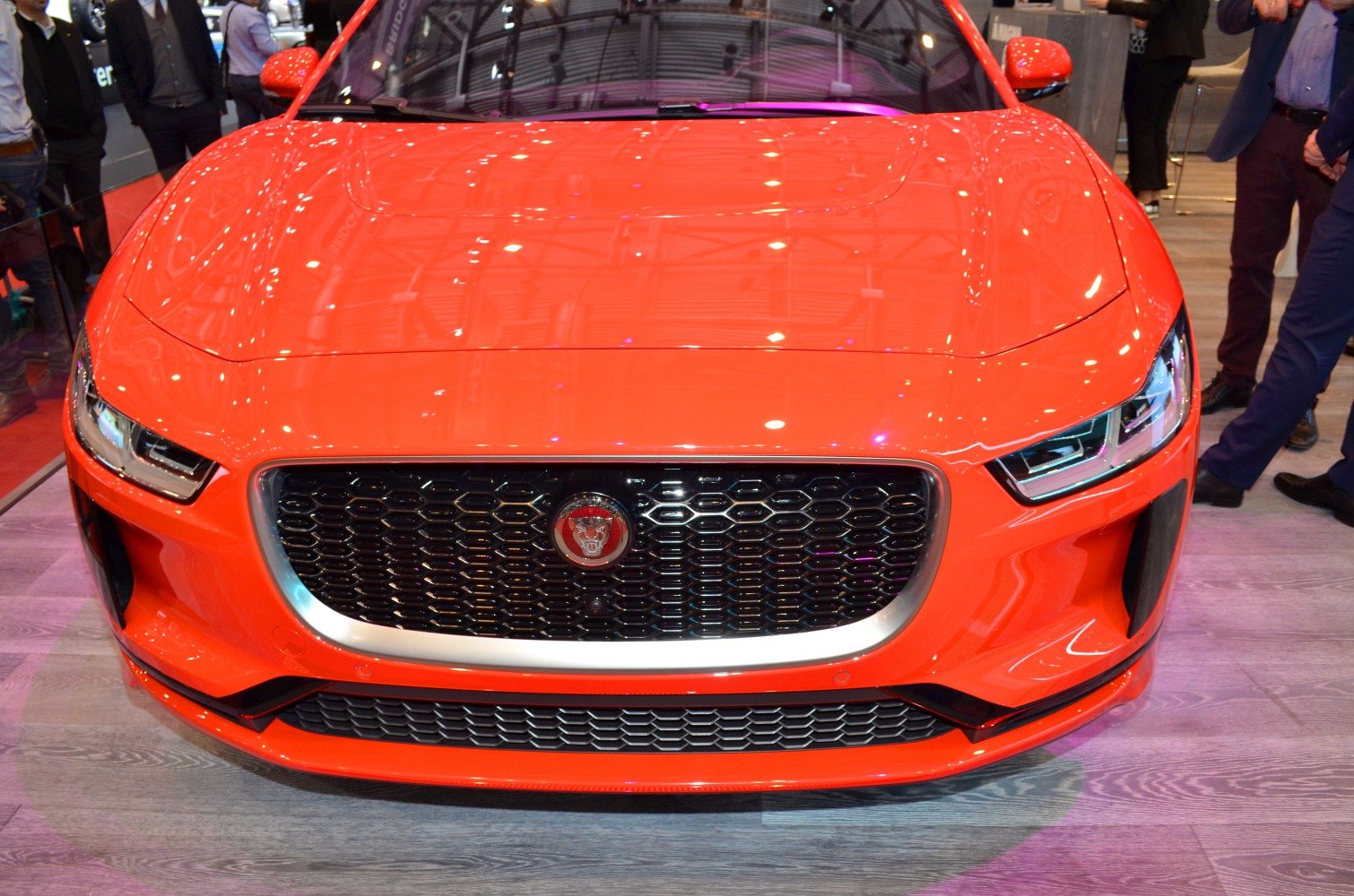Close-up of front grille and LED headlights on a sleek electric SUV