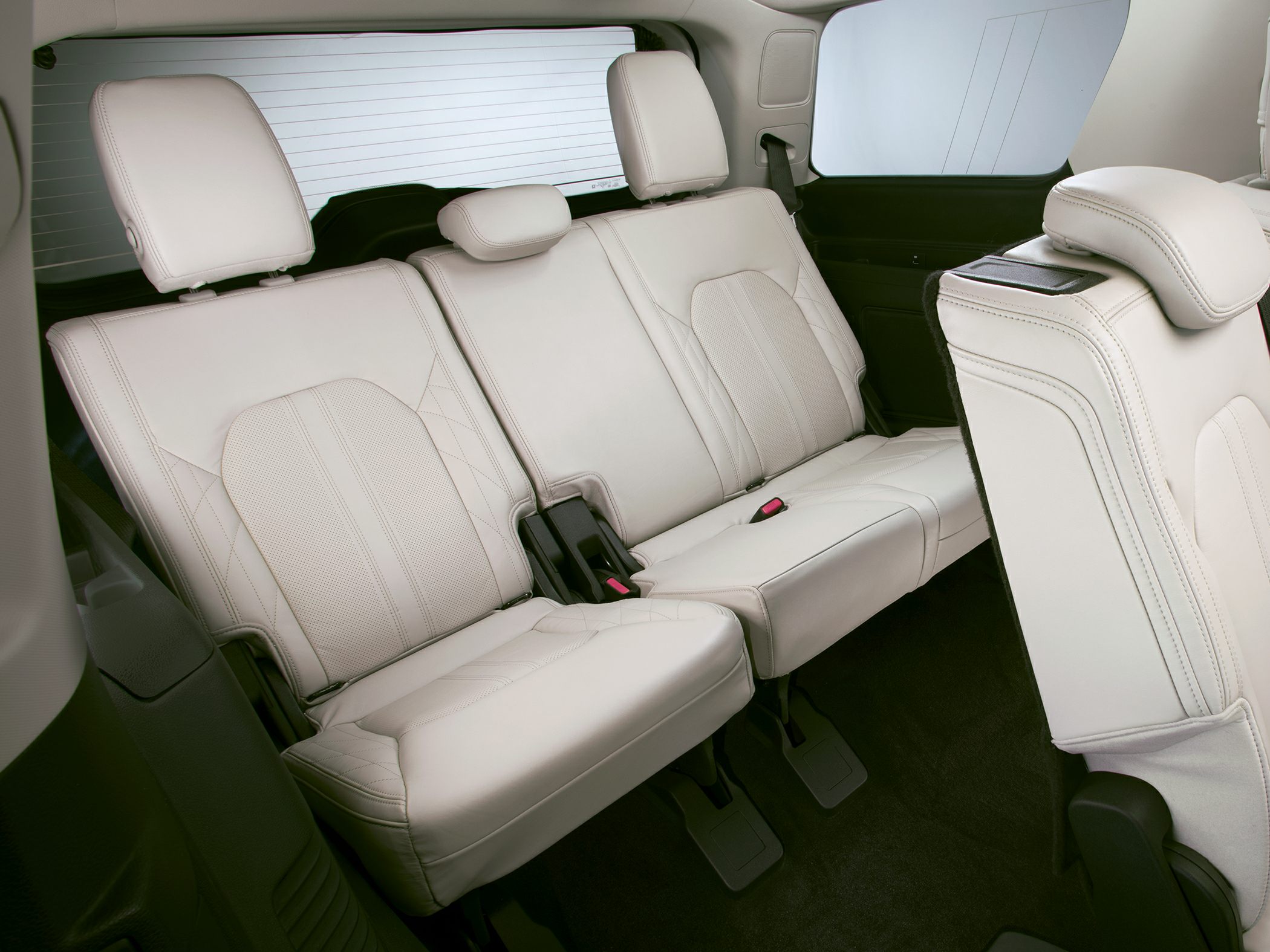 Luxurious rear seats with leather upholstery and adjustable headrests.