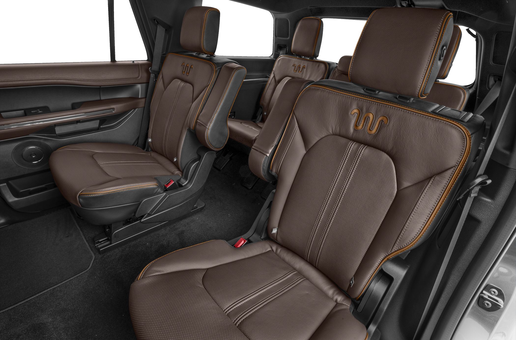 Brown leather seats with orange stitching and armrests in premium SUV interior