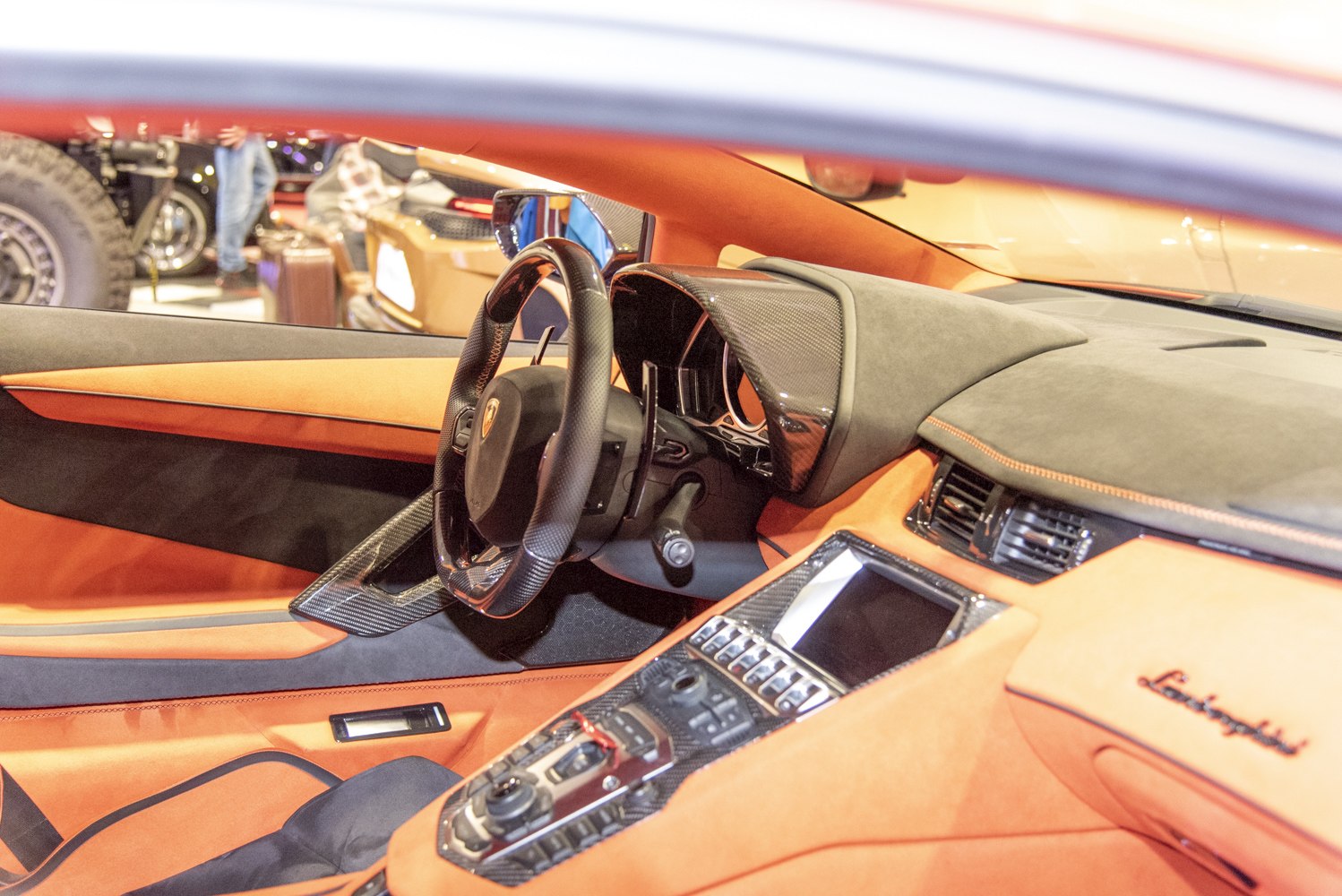 Luxury car interior with steering wheel and dashboard details