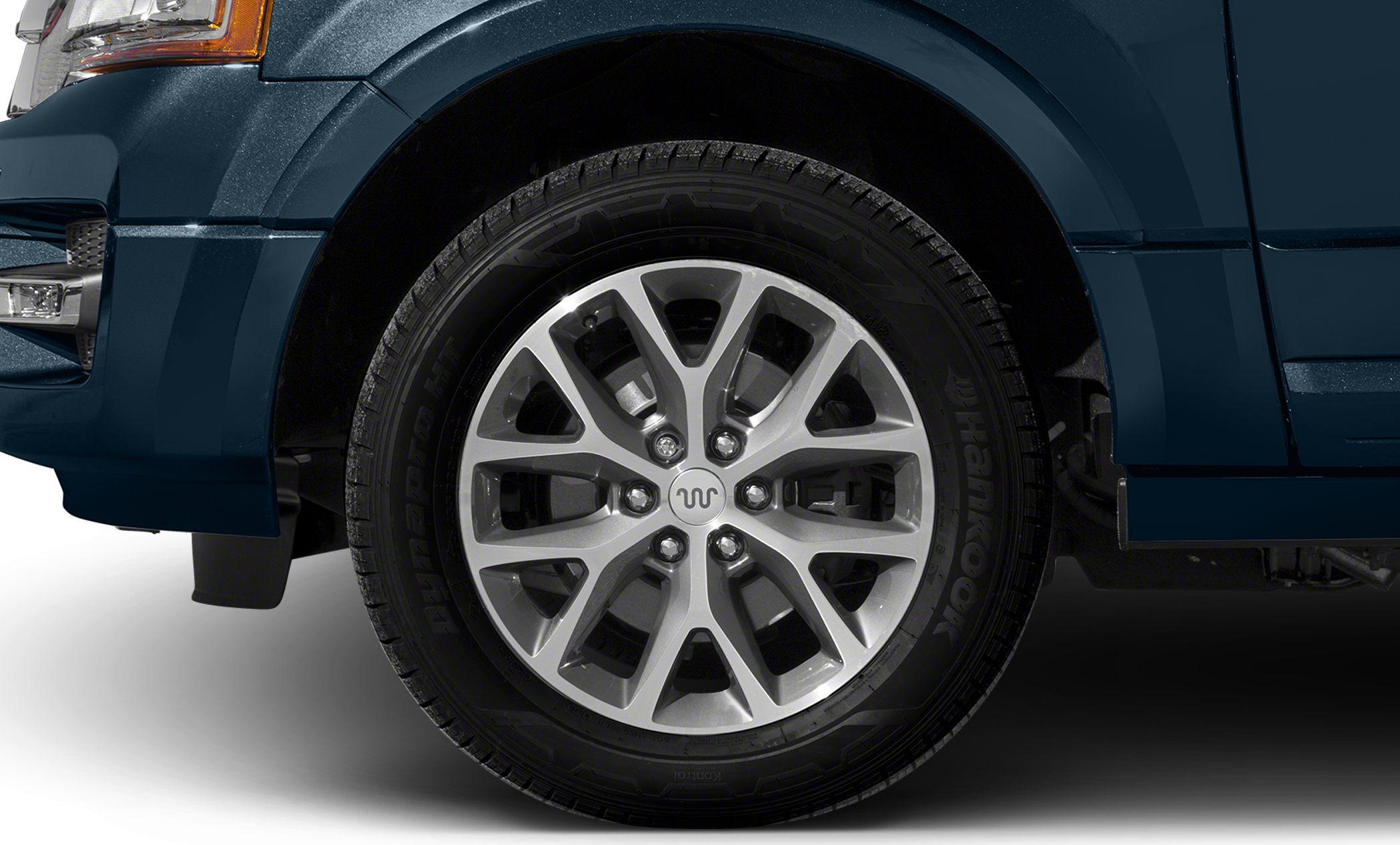 Close-up of alloy wheel and tire with detailed tread pattern