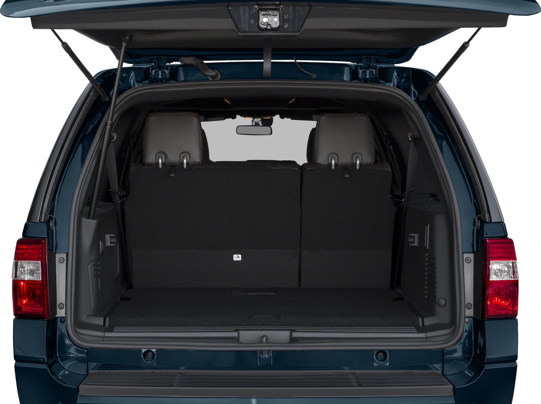Open rear cargo area and tailgate, third-row seat backs visible