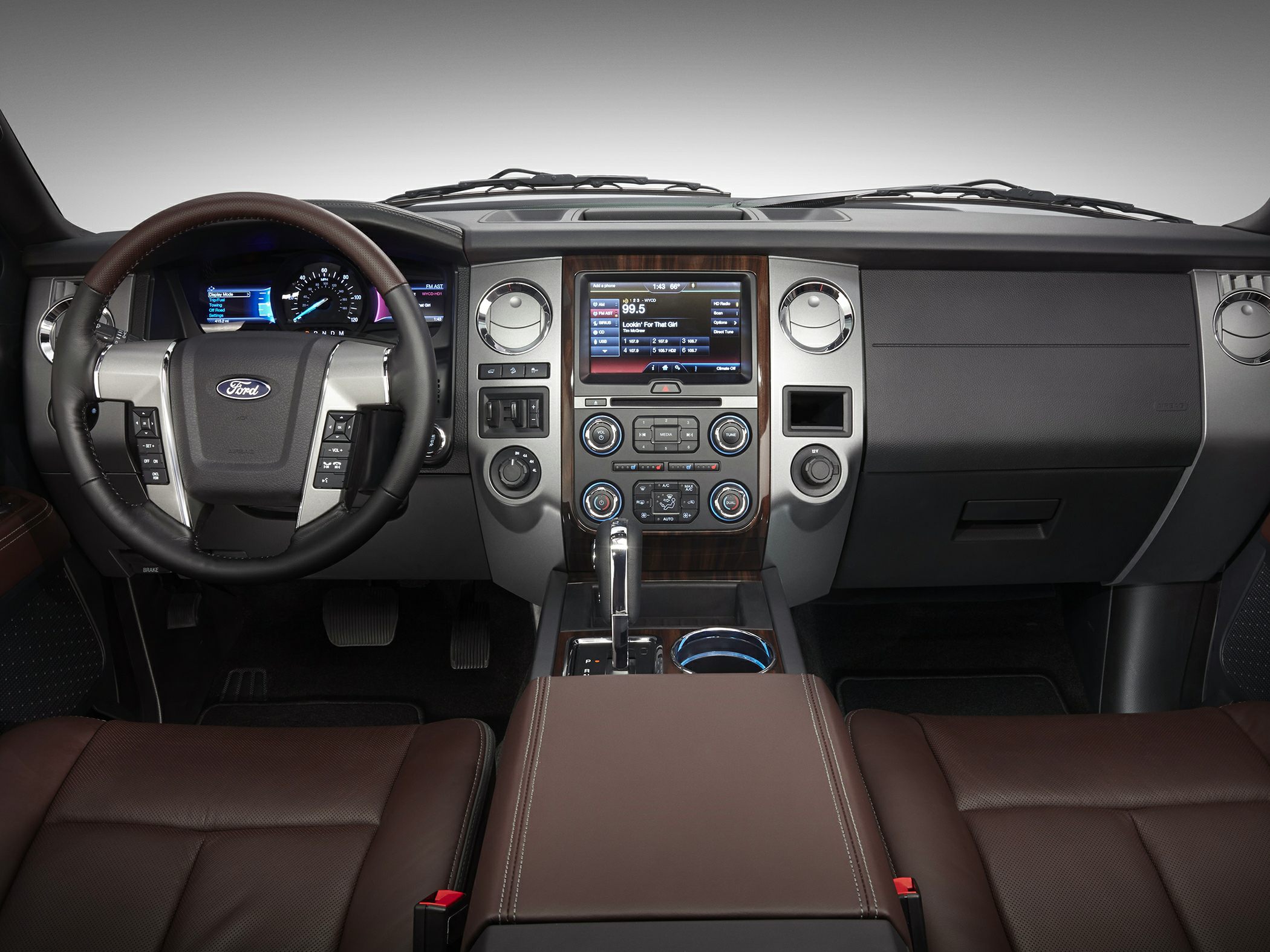 Dashboard and steering wheel with infotainment screen and controls