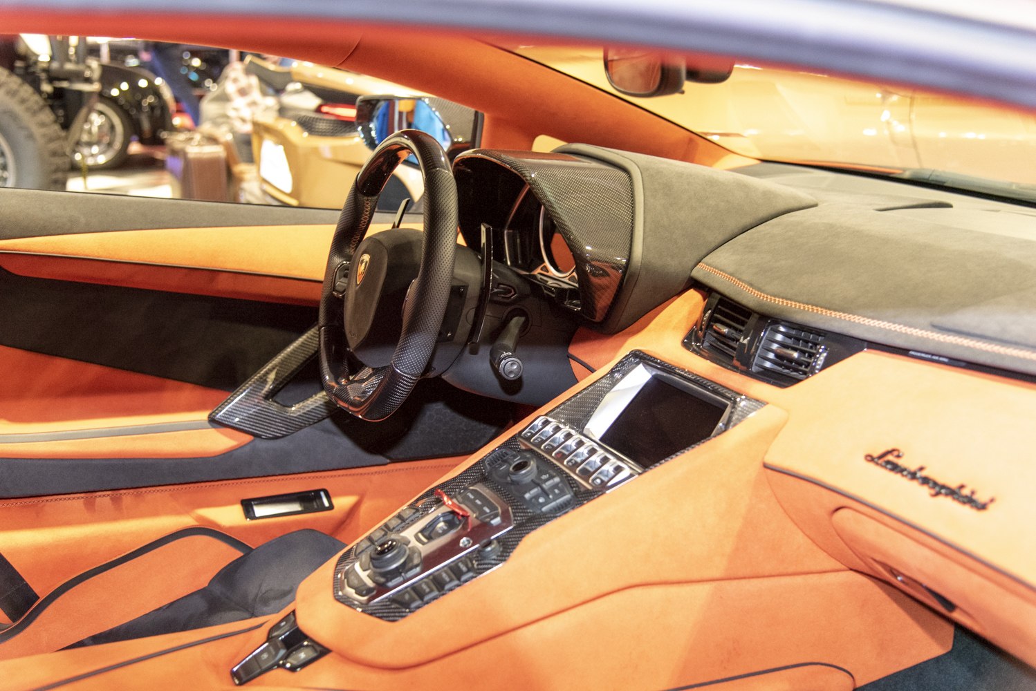 Luxury sports car interior with carbon fiber dashboard and control console