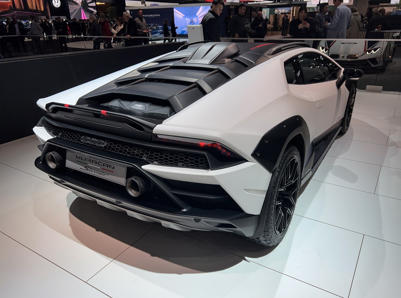 Rear view of sporty Lamborghini with aggressive exhausts and rugged wheel arches