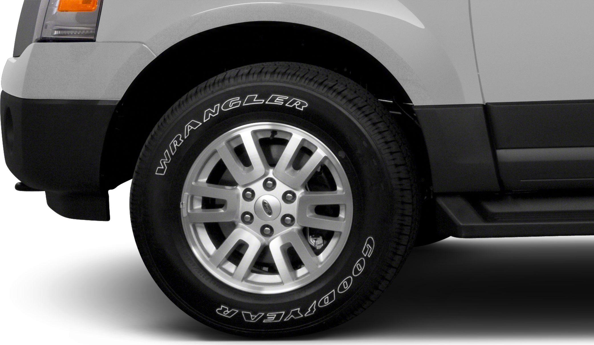 Alloy wheel and Goodyear Wrangler tire close-up on SUV