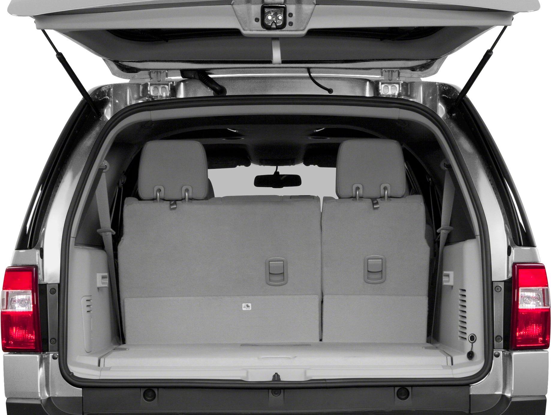 Rear cargo area with open tailgate and upright seats