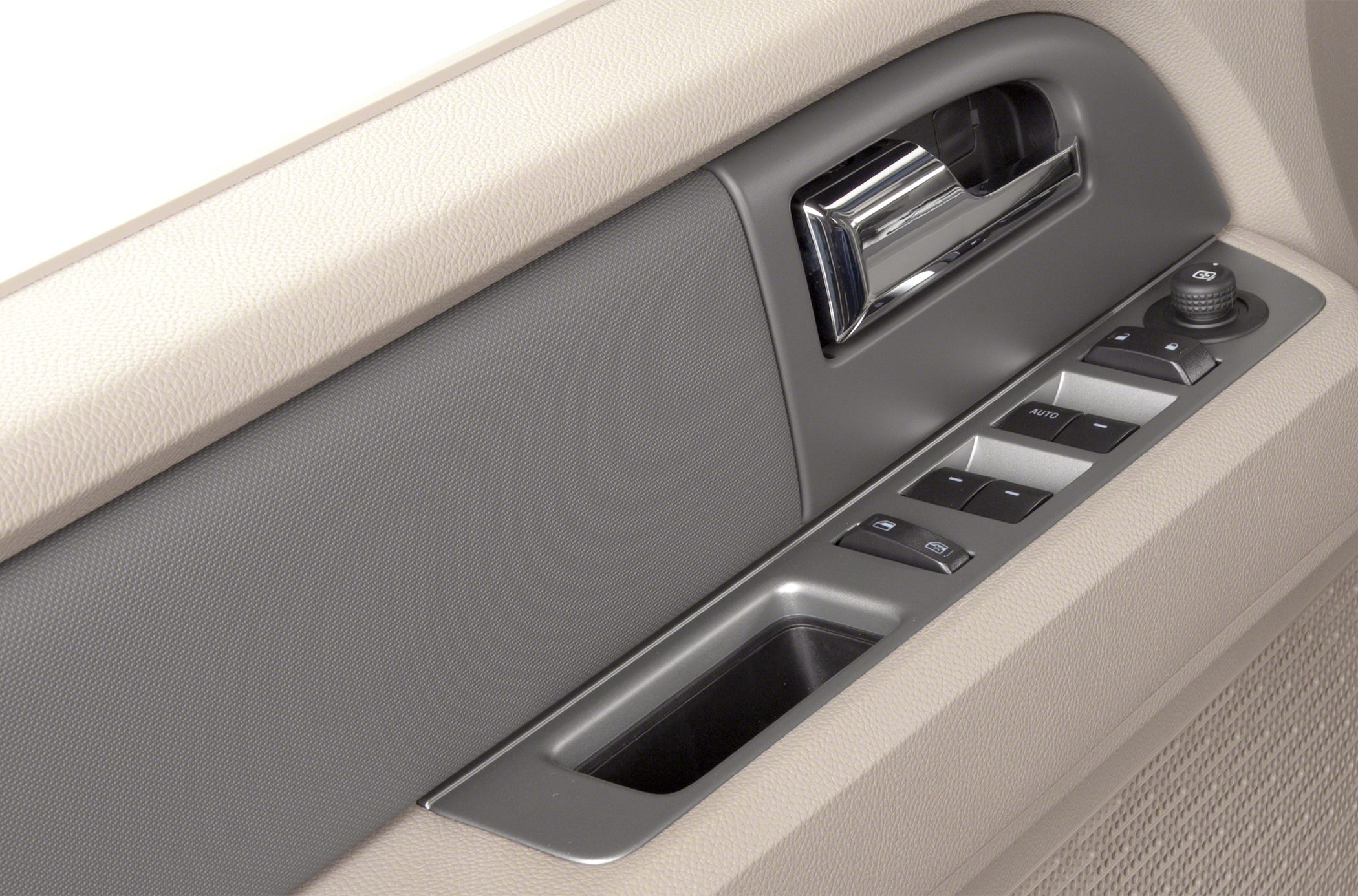 Interior door panel with window switches and door handle.