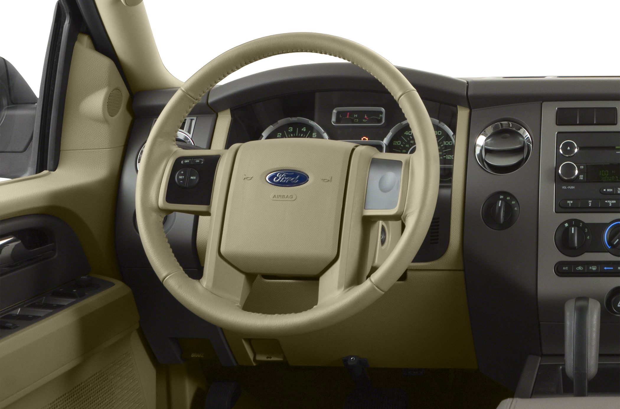 Beige steering wheel and dashboard with car controls and gauges.