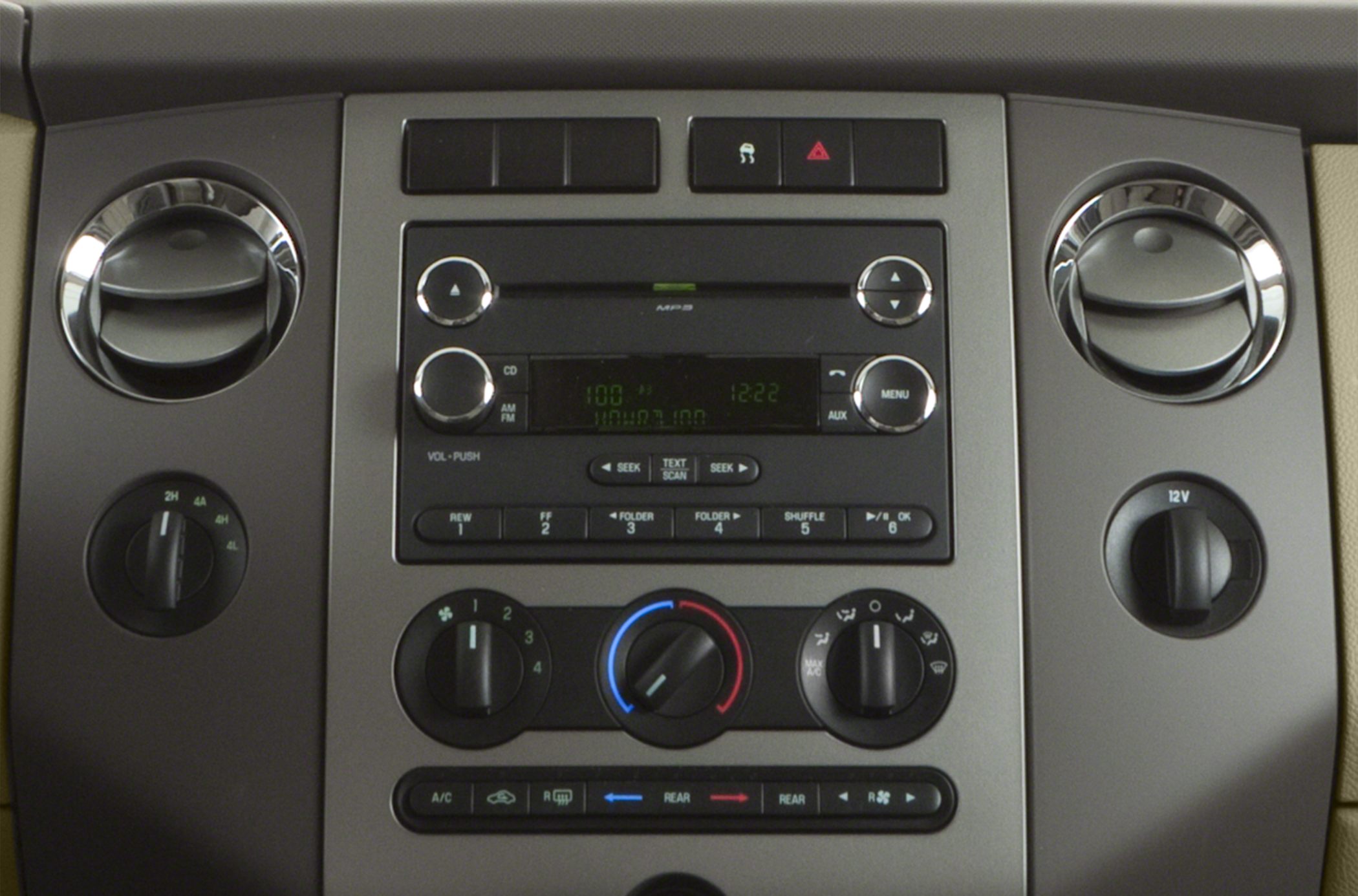 Car dashboard with radio and climate control knobs