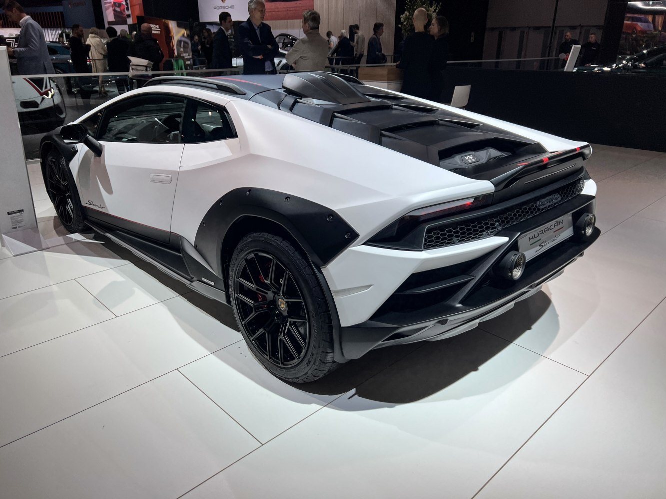 Rear and side view showing black fender flares and dual rear exhaust