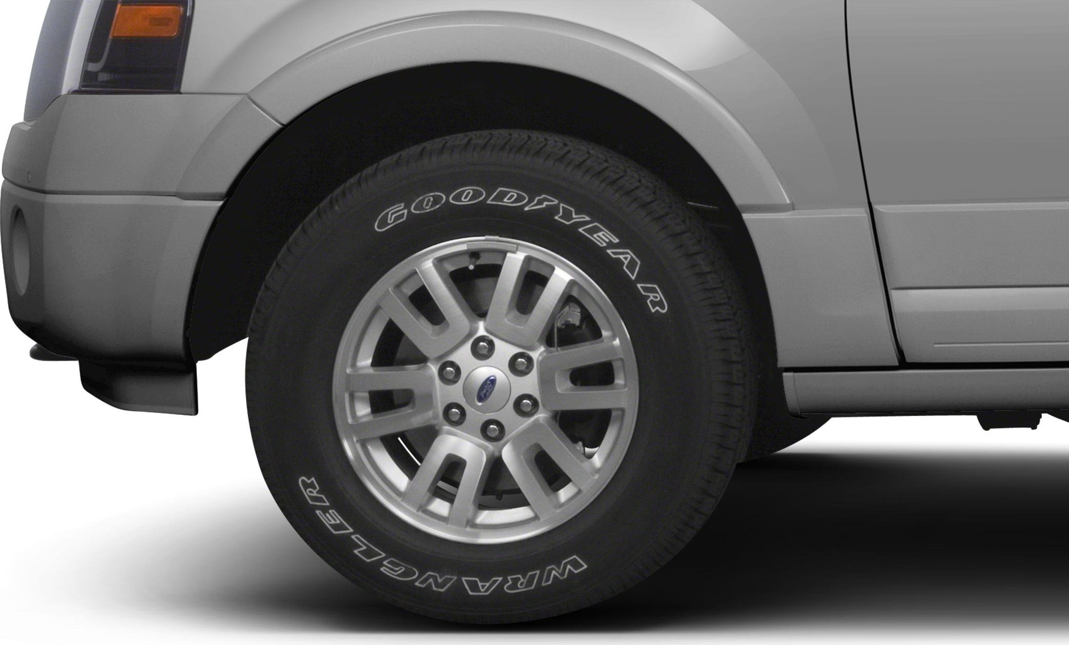 Close-up of alloy wheel with Goodyear Wrangler tire on SUV.