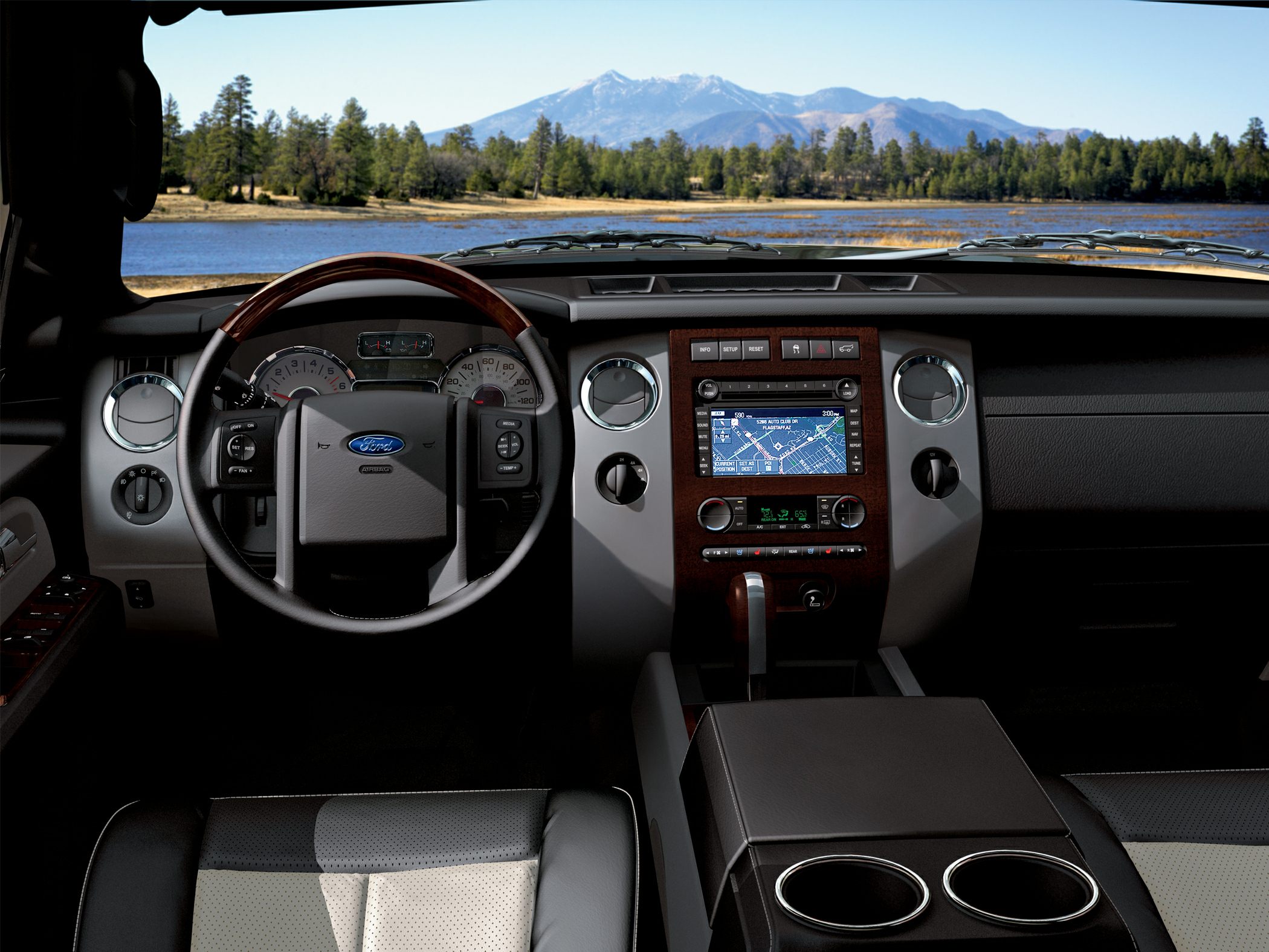 SUV interior with wood trim and navigation system display