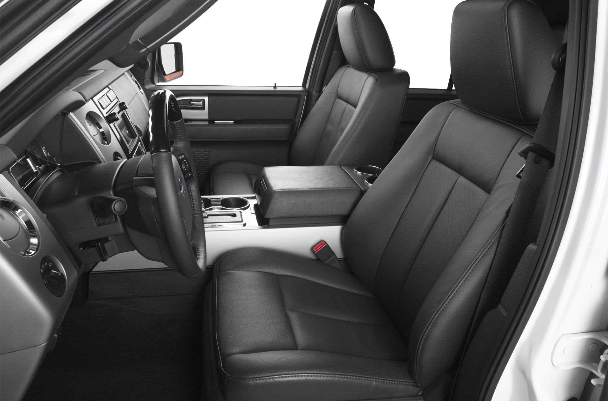 Black leather front seats with a modern dashboard and center console design.