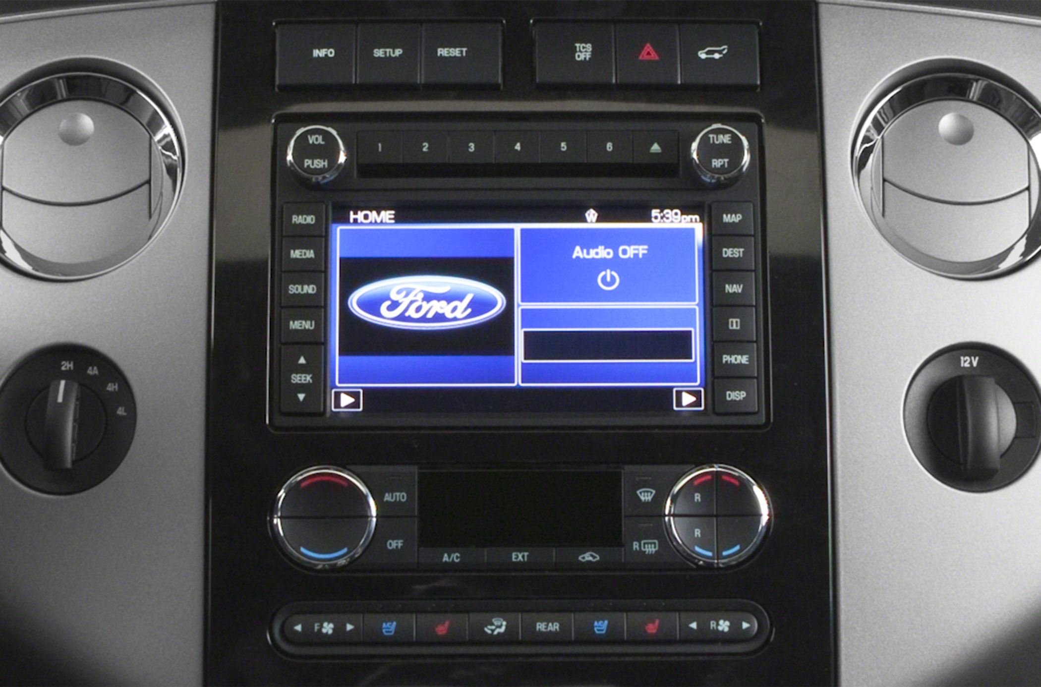 Dashboard infotainment touchscreen and dual zone climate controls.