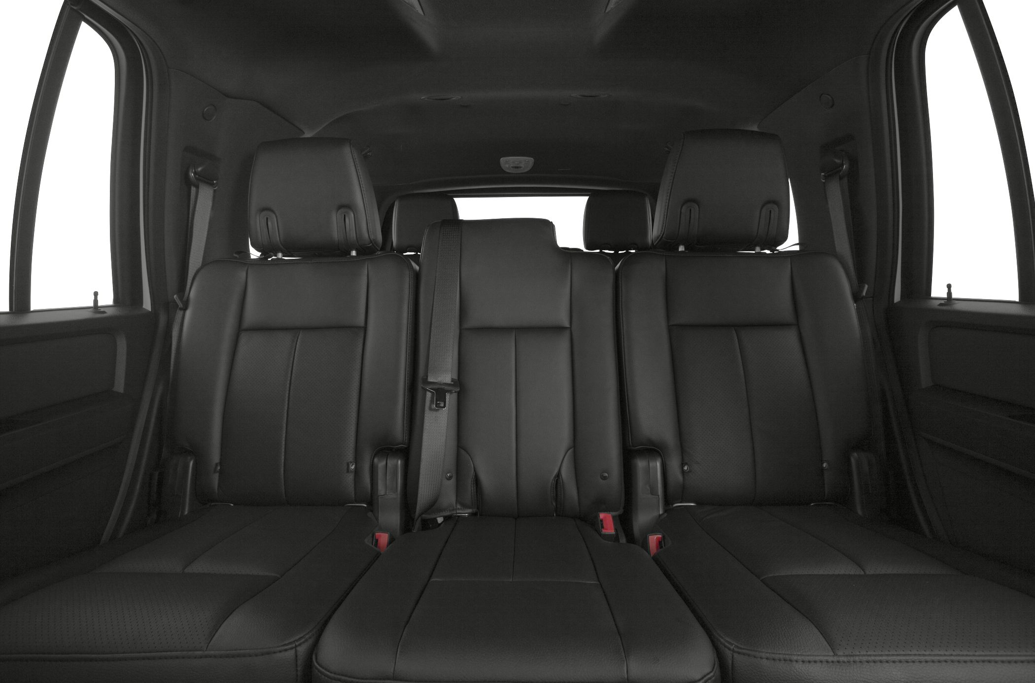 Black leather three-seat third row with seat belts in SUV interior.