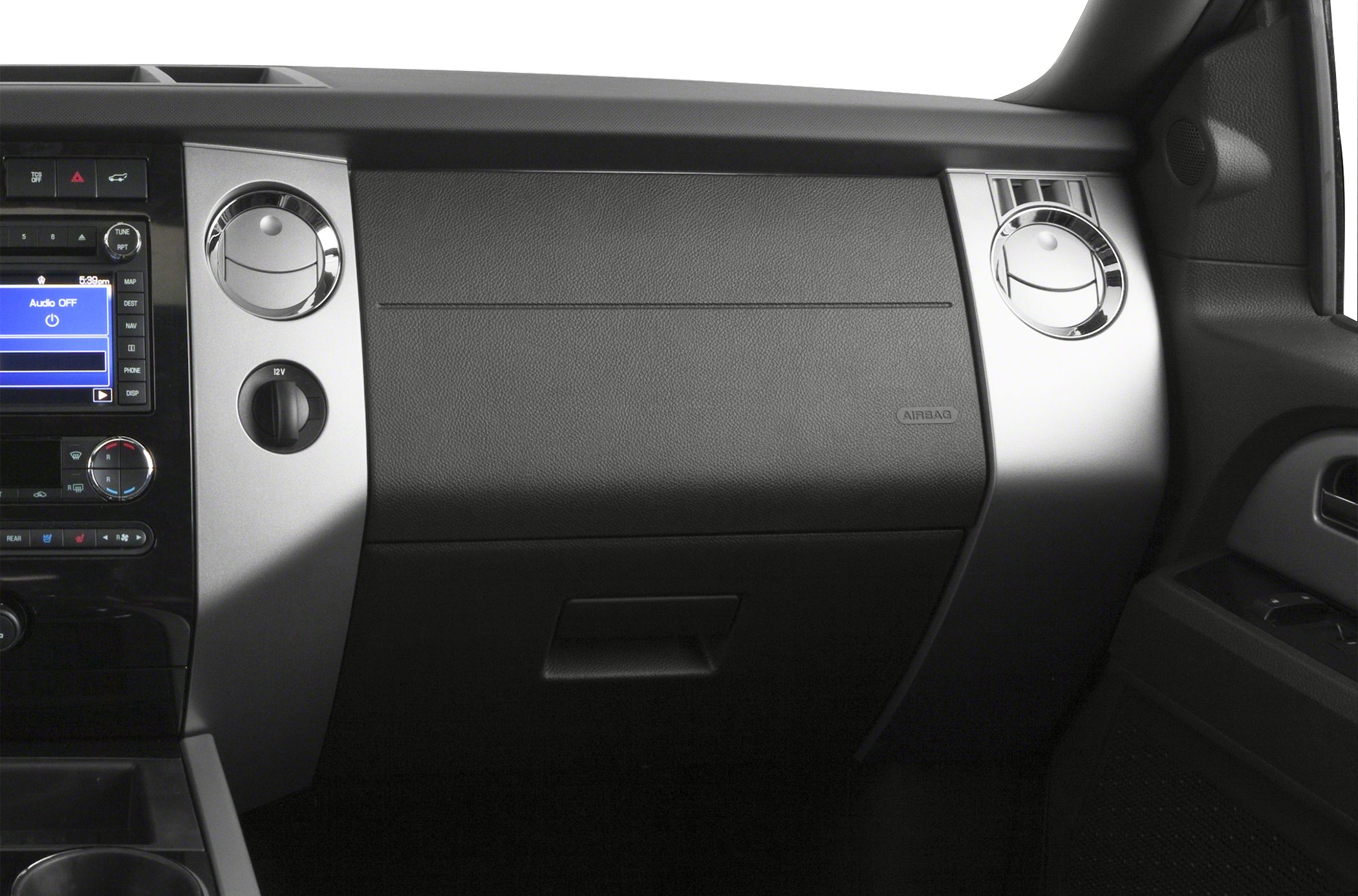 Dashboard glove compartment and round air vents with control panel.