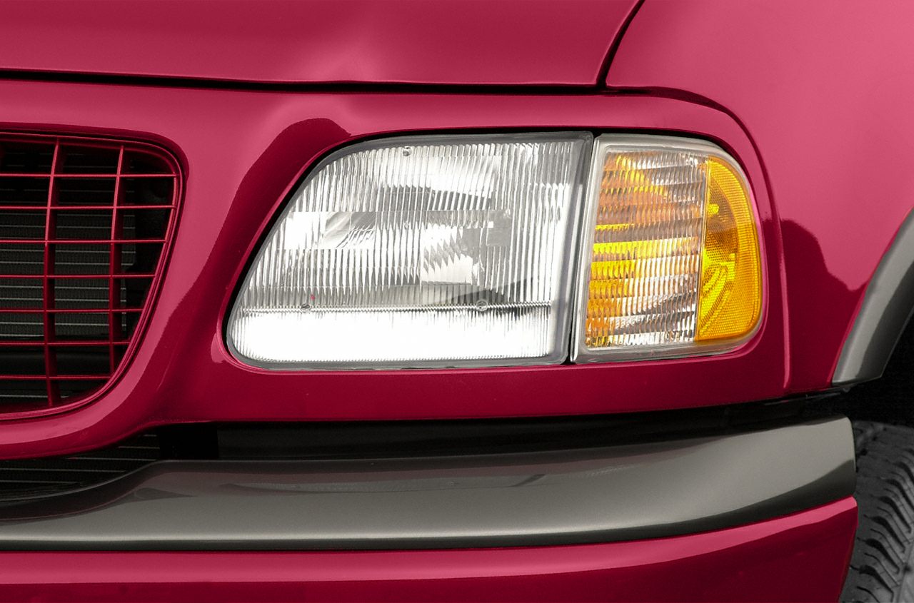 Closeup of front headlight and grille details